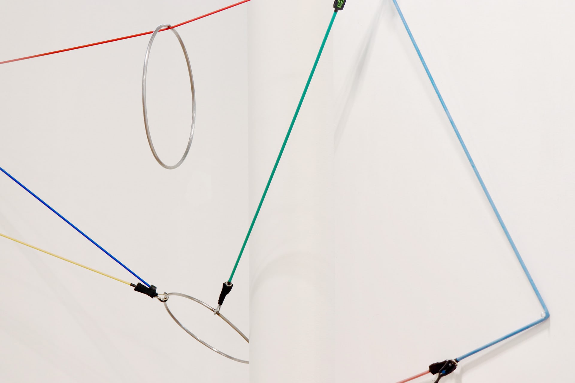 Rubber resistance bands tautly suspended across a space