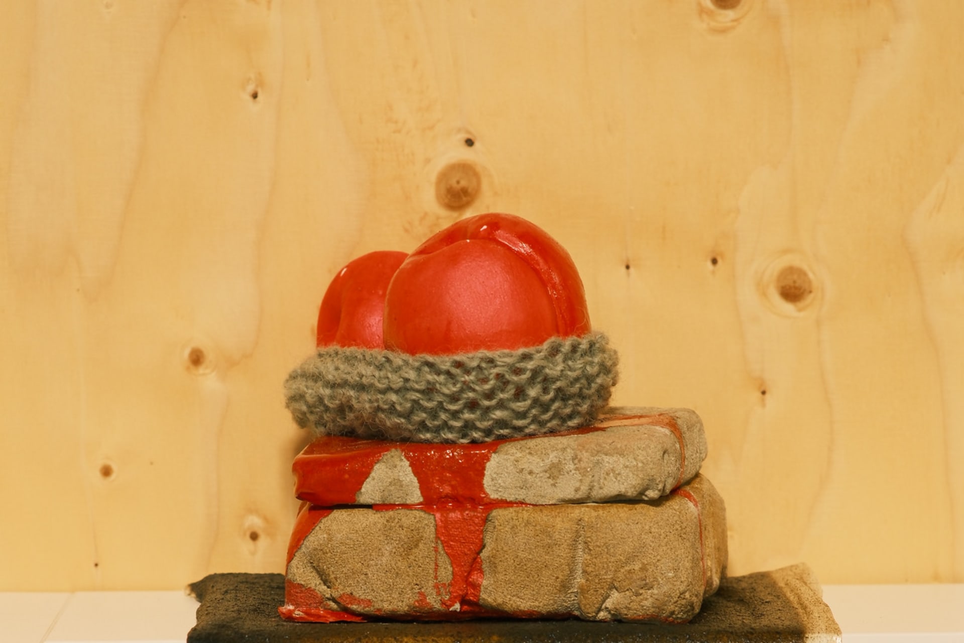 Two red pink Peaches ceramic sculptures 