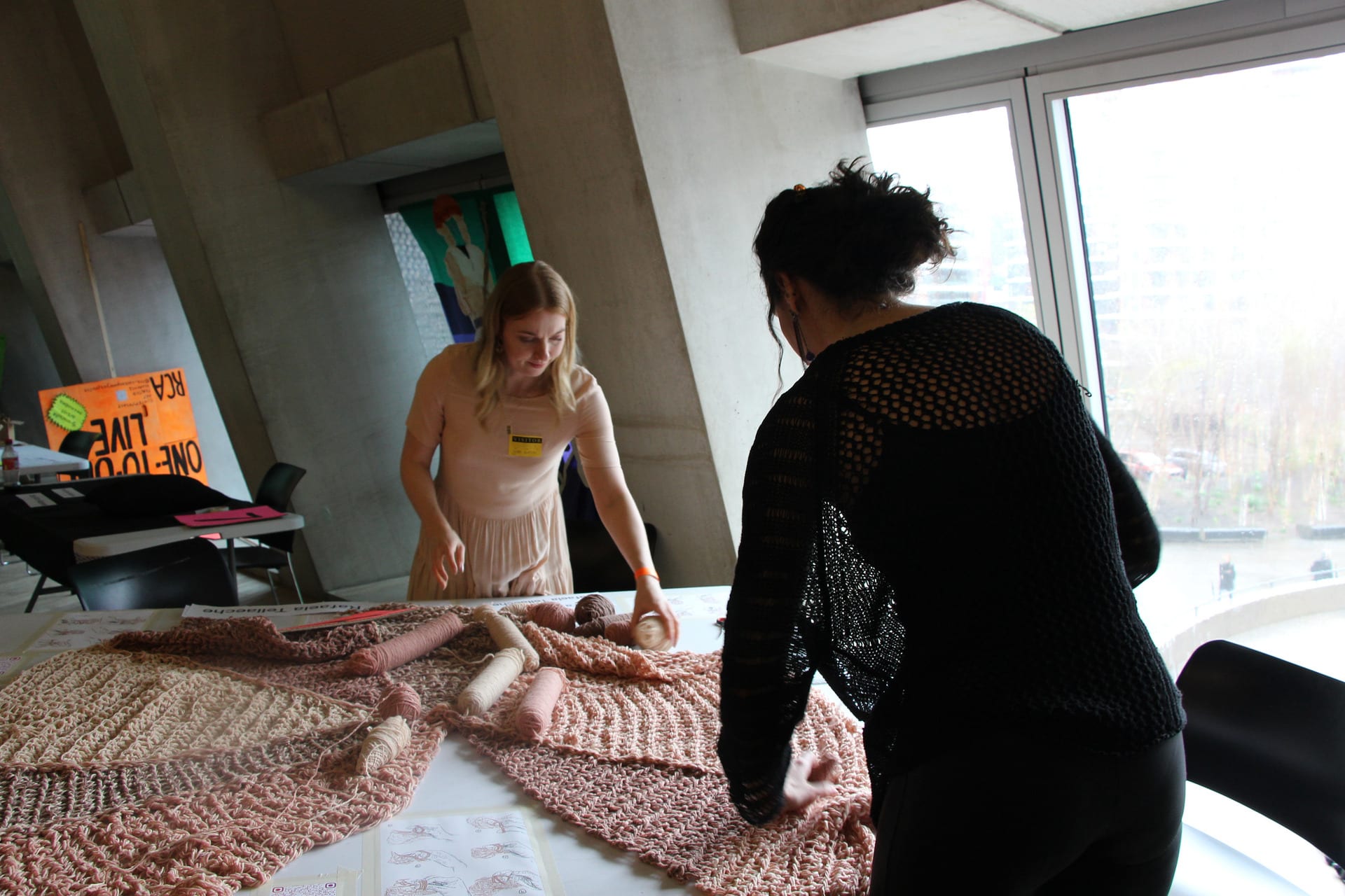 Two woman setting up a knitting project