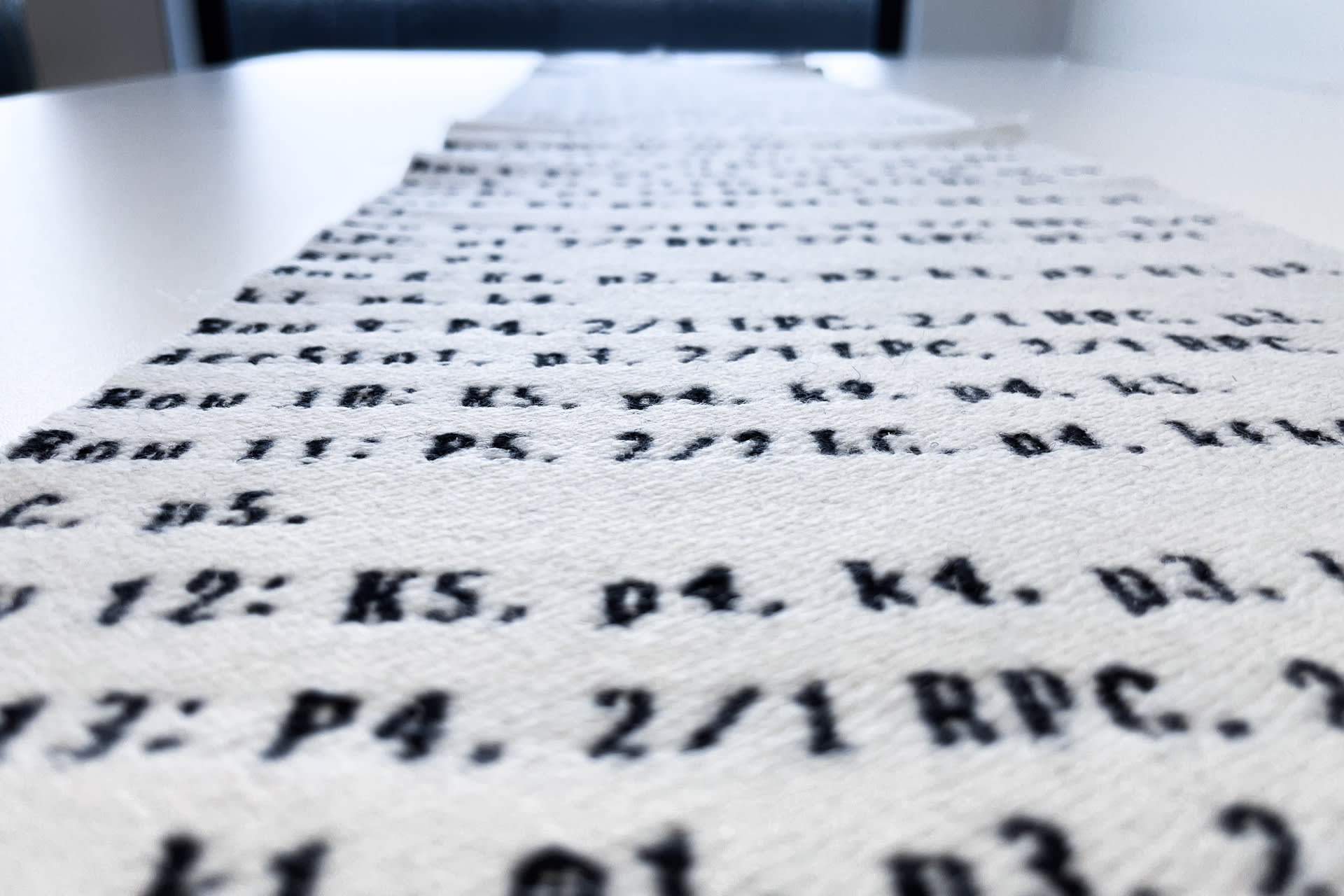 Woven piece of fabric with text woven in