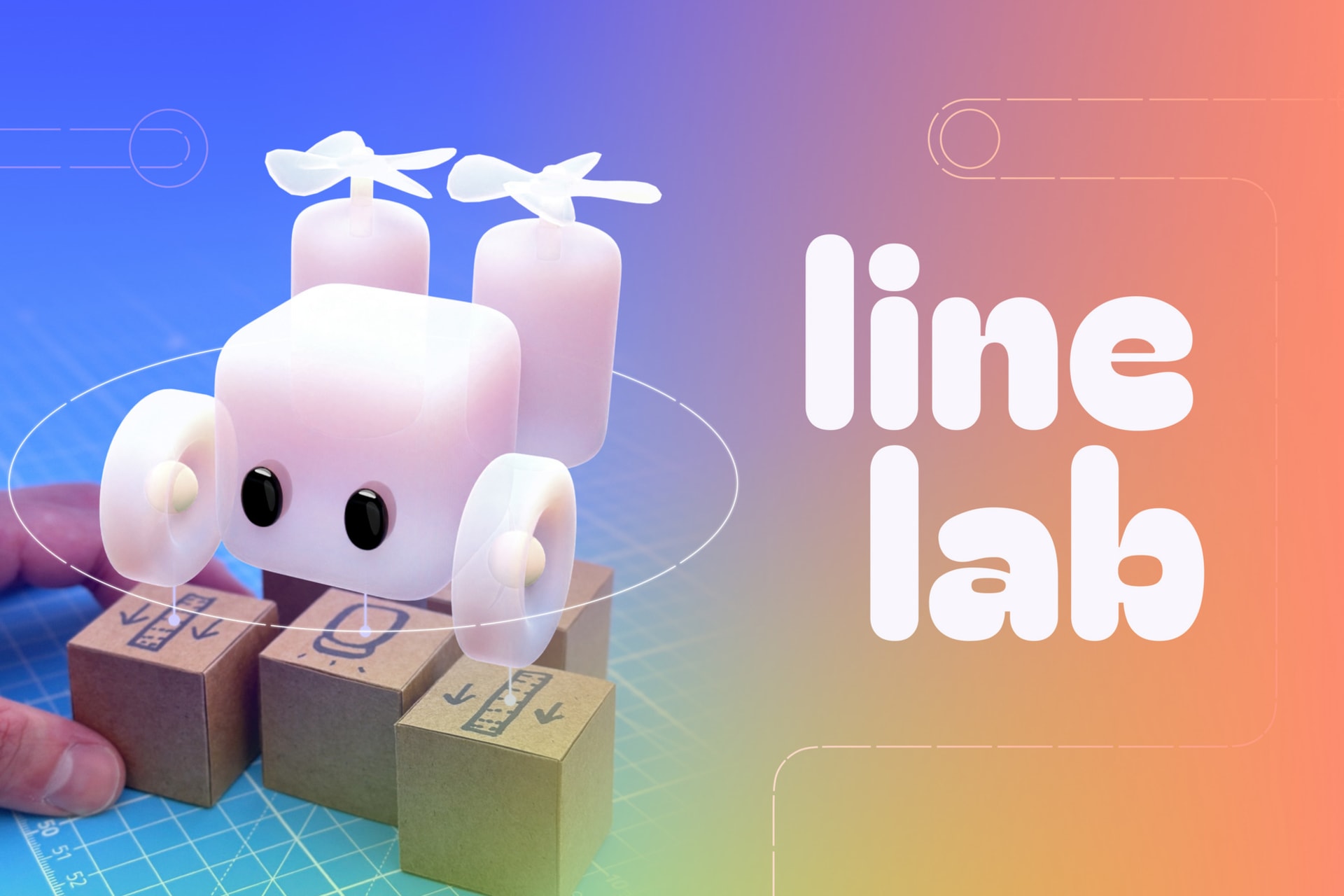 An augmented reality robot on top of paper cardboard cubes, next to the words "Line Lab"