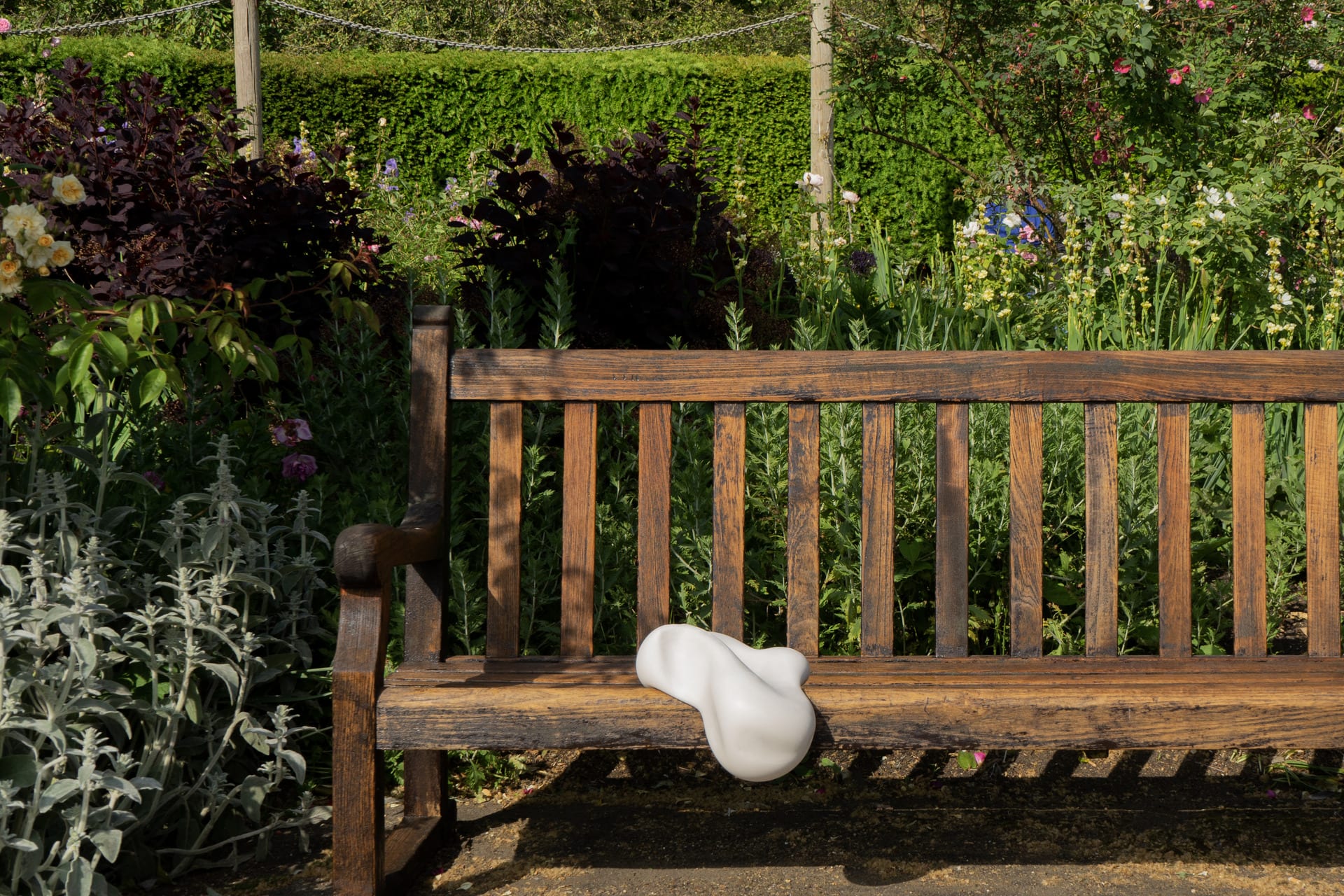 White cushion on a park bench