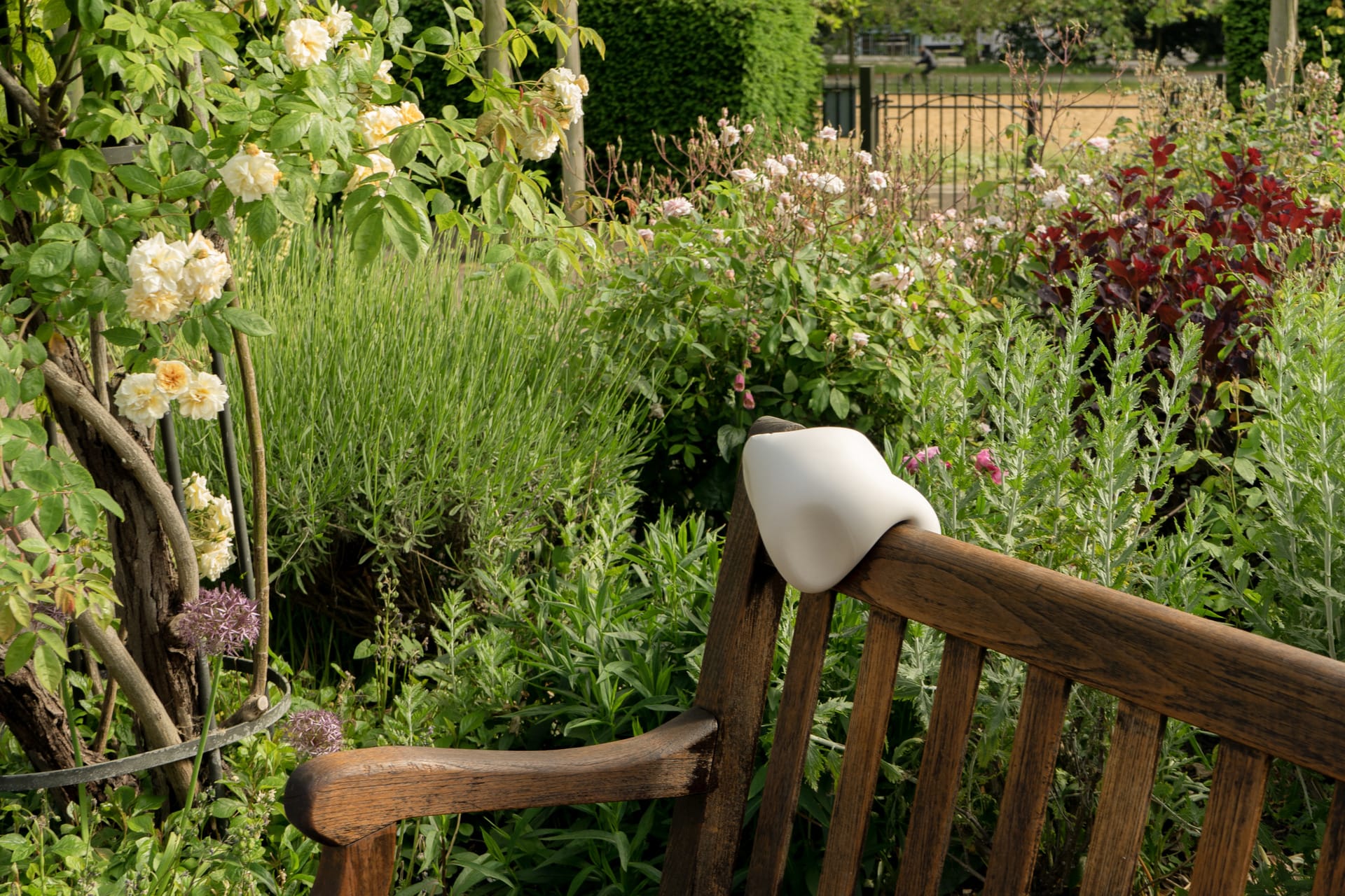 White cushion on a park bench