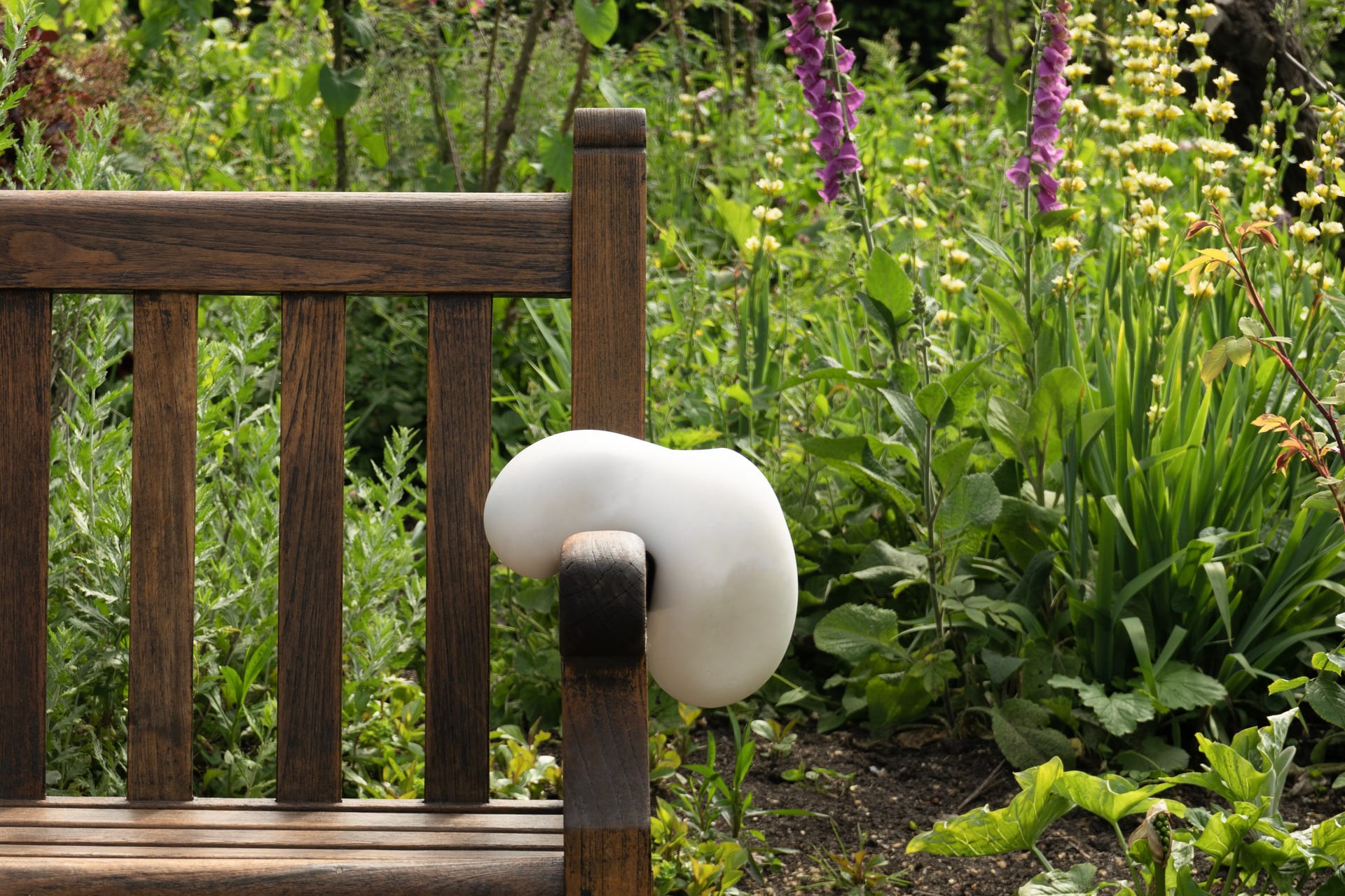 White cushion on a park bench