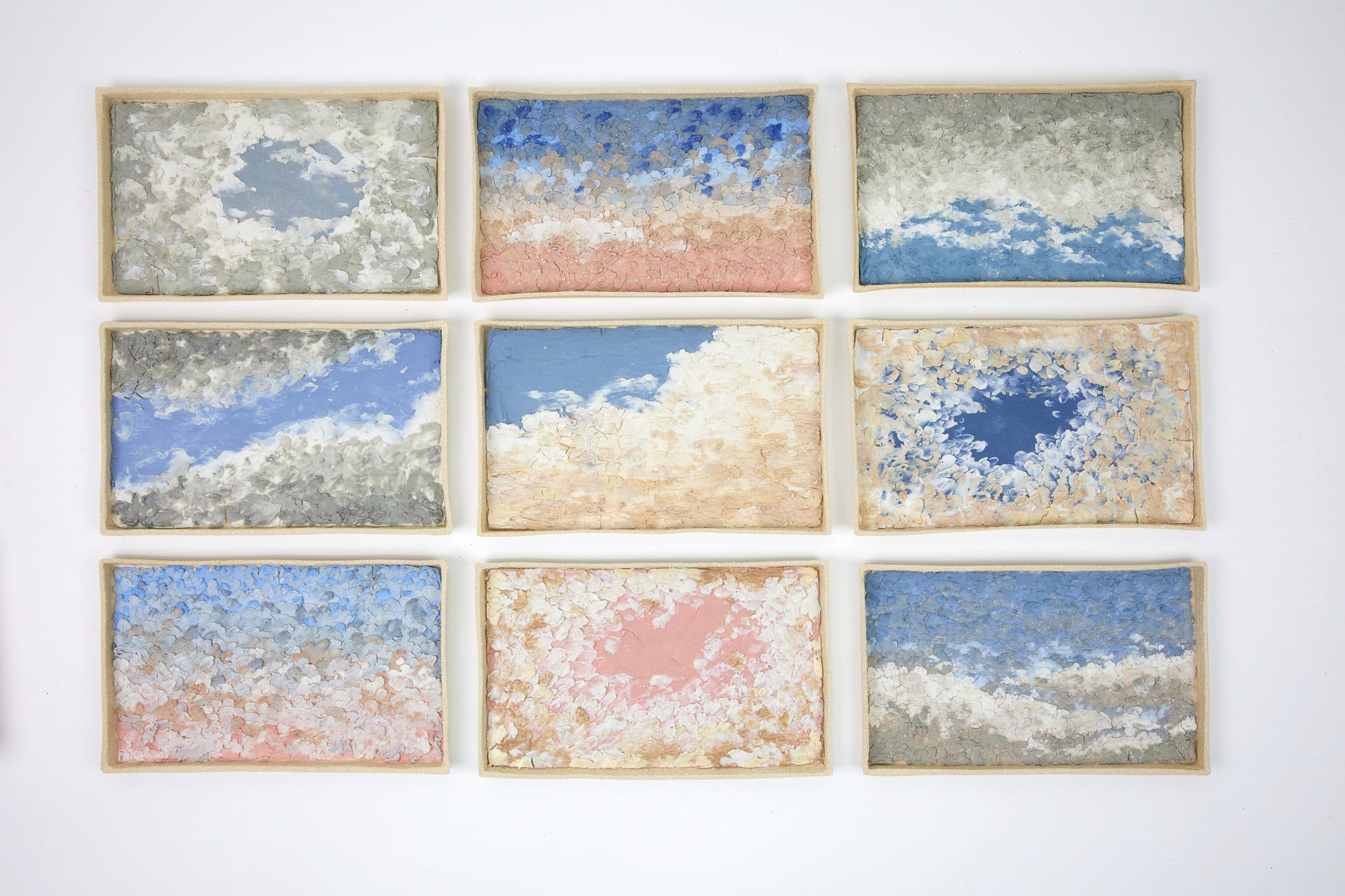 9 wall based ceramic pieces those are inspired by sky and cloud with bright and tender colours.