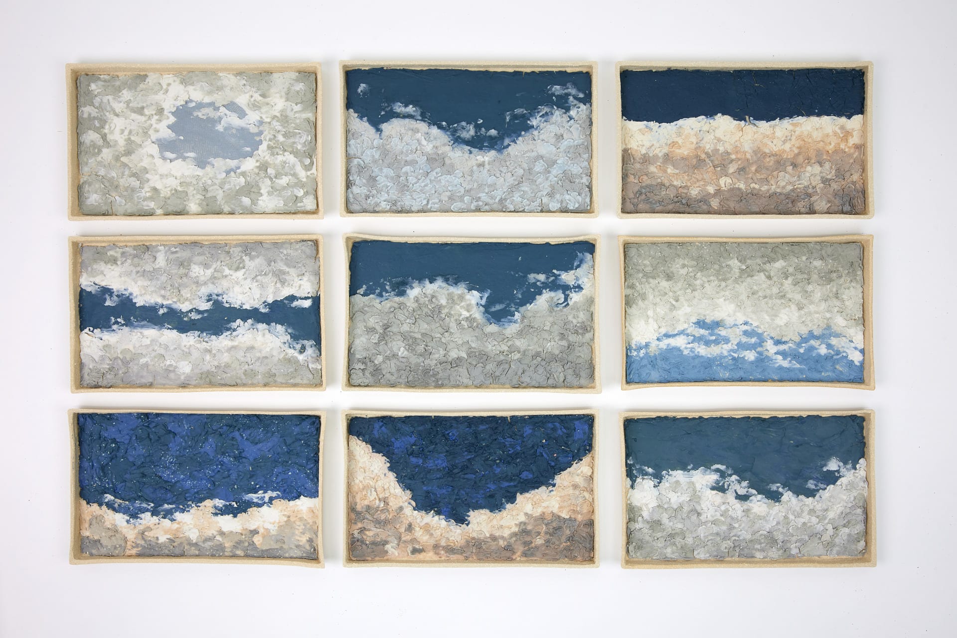 9 wall based ceramic pieces those are inspired by sky and cloud with deep colours.