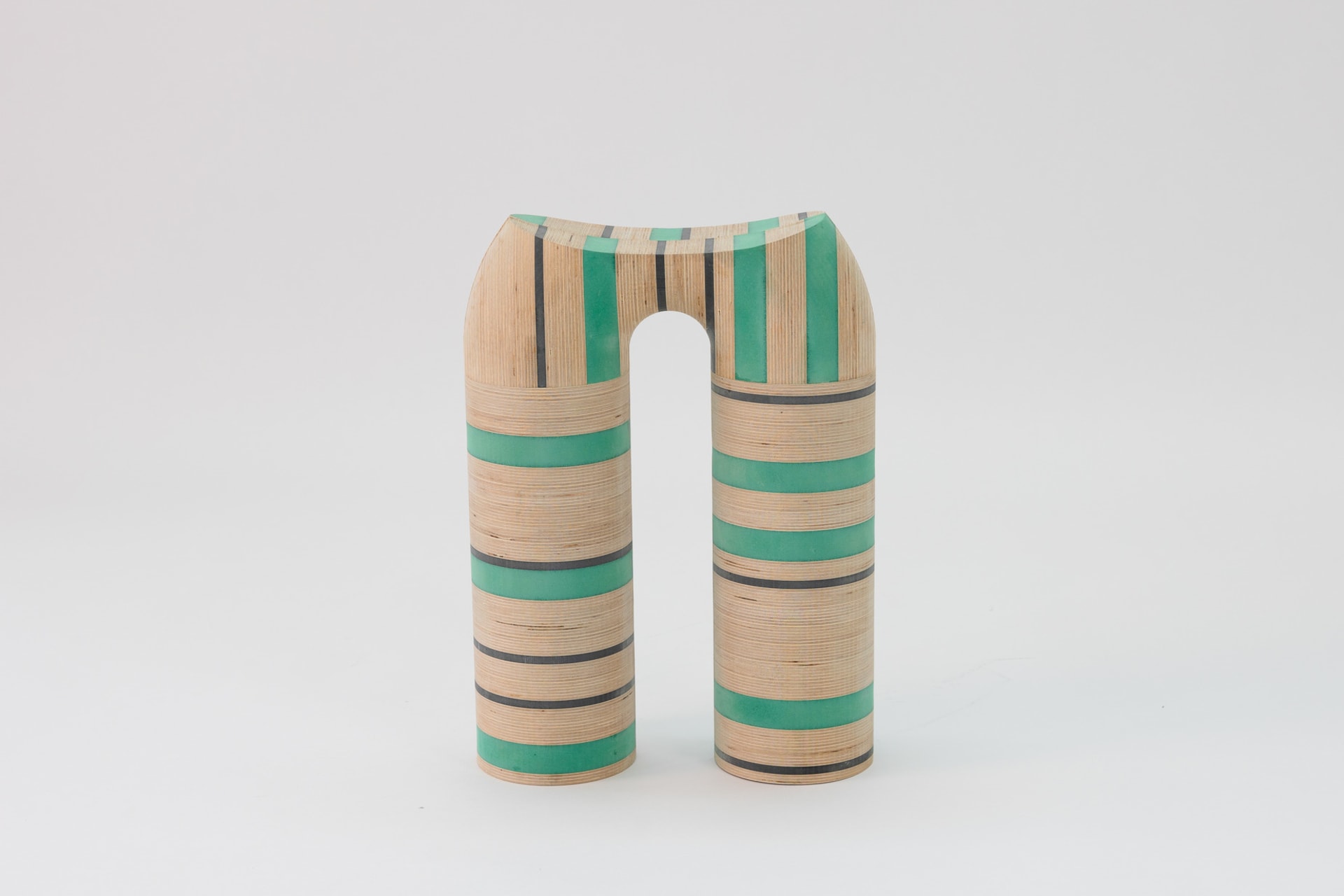 Striped wooden legs for a stool - green, black valchromat MDF and birch plywood.