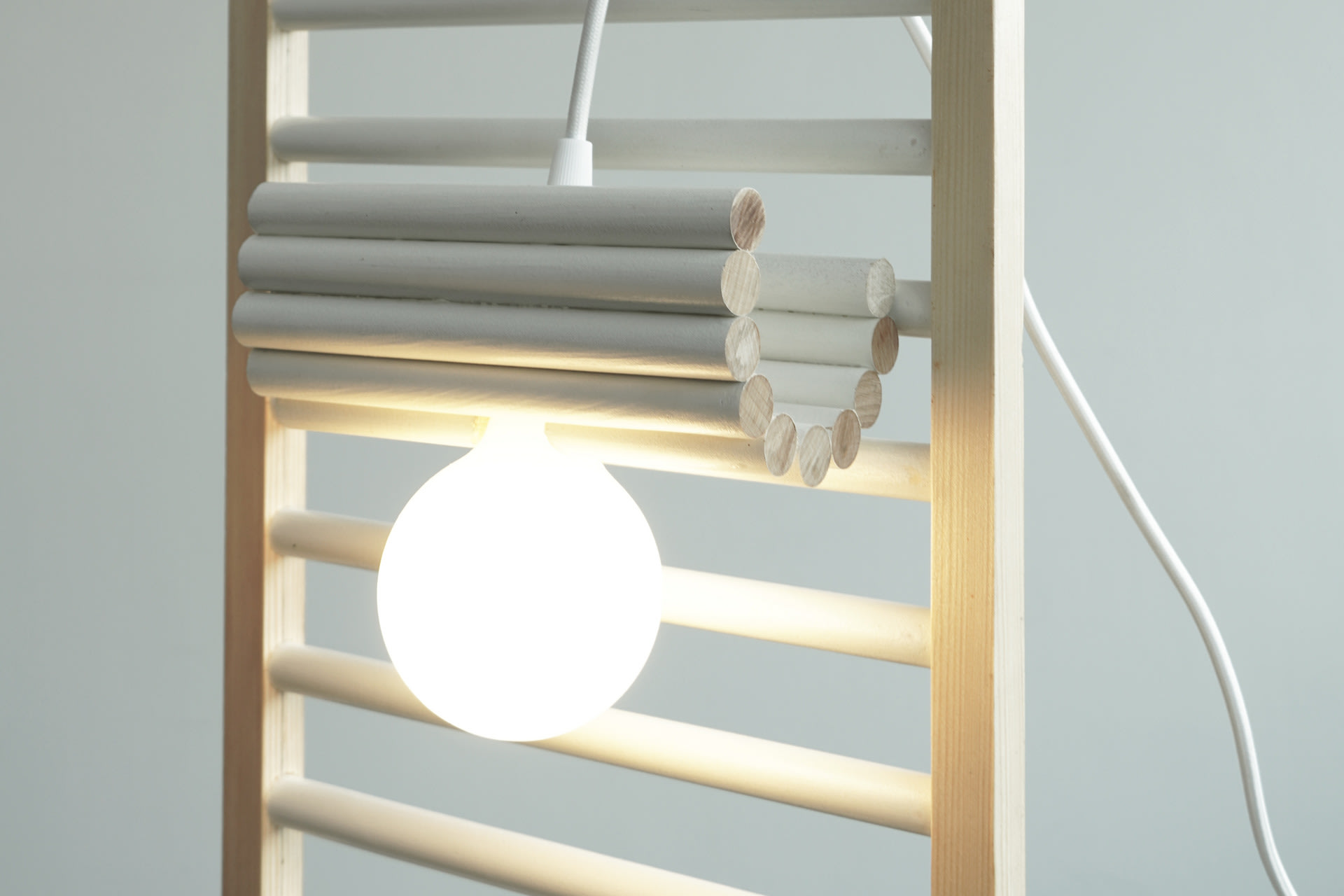 A lamp made from the rails of a cot