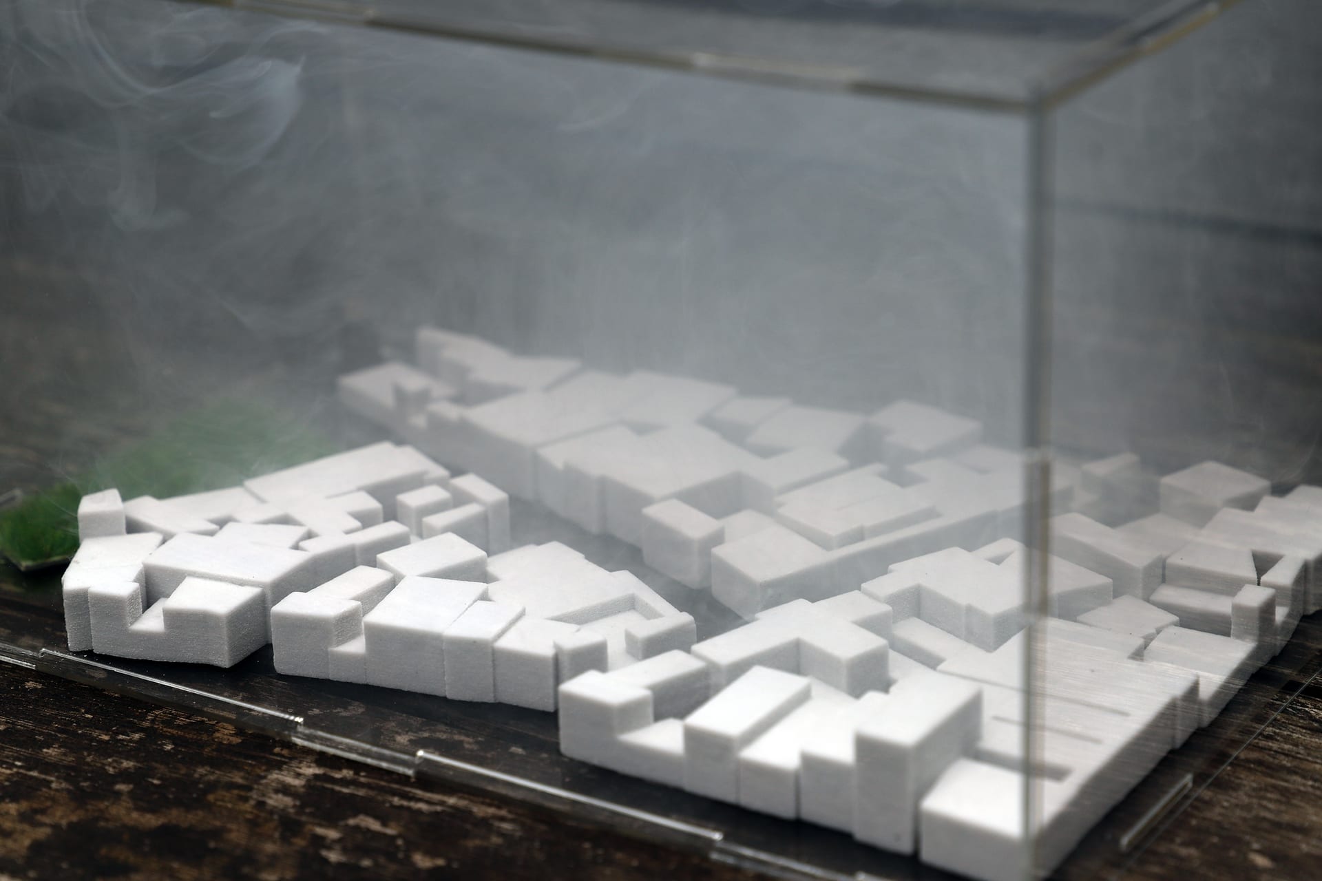 3d model of Delhi enclosed in a transparent container with smoke filled inside, close up shot 