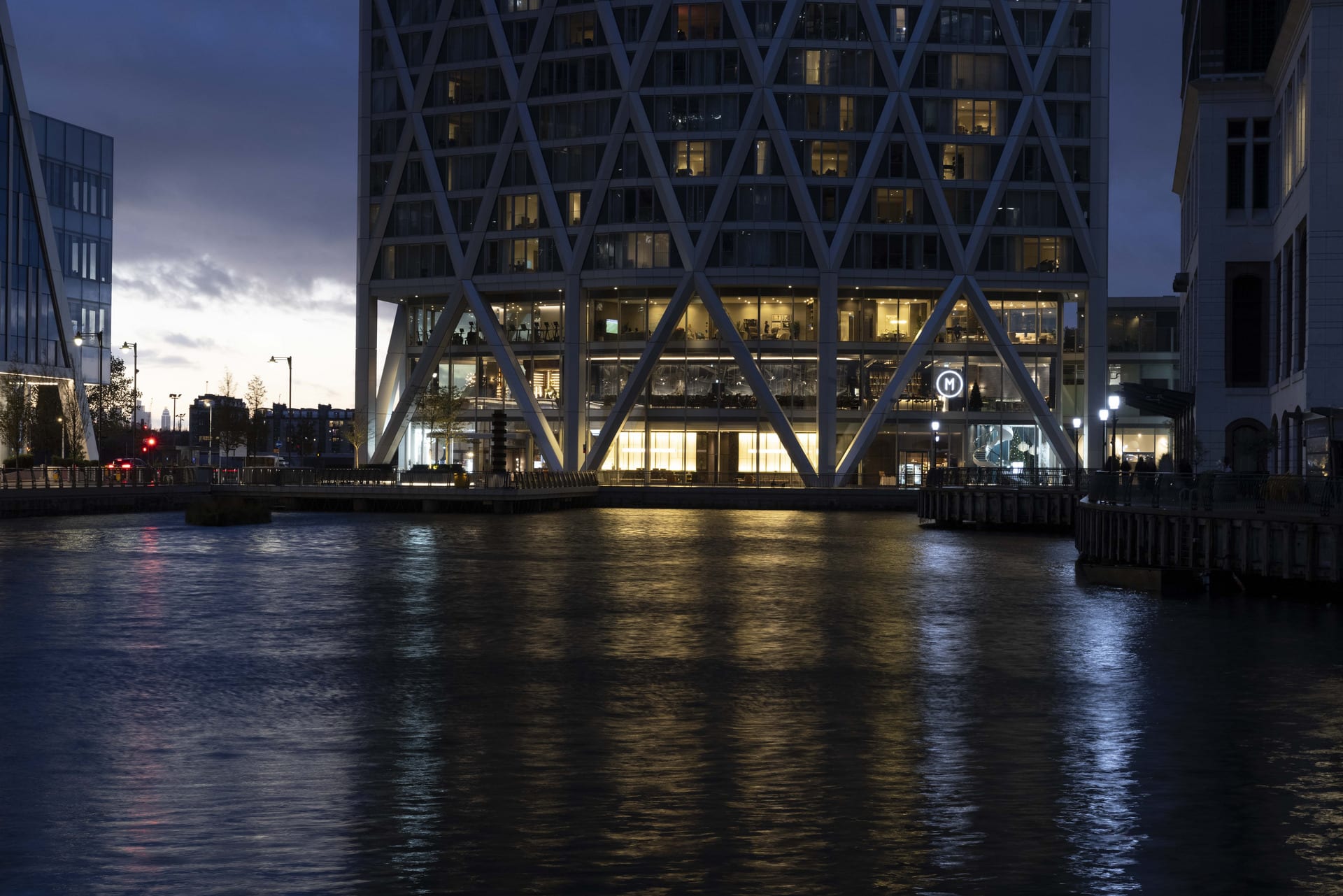 Canary Wharf at twilight depicting light reflecting off the surface of the water