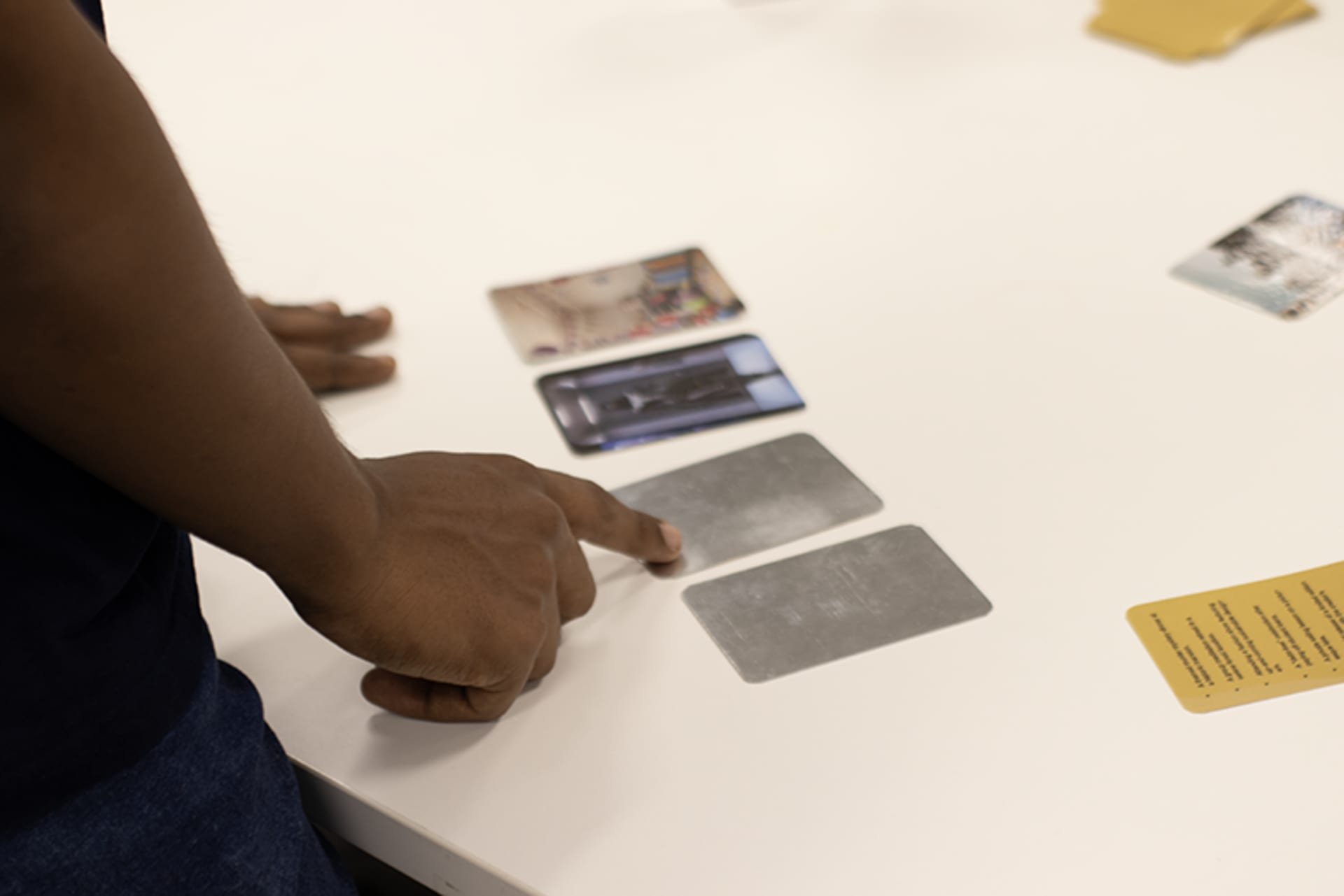 The players take turns. Player 1 reveals the first content card of their choice one at a time.