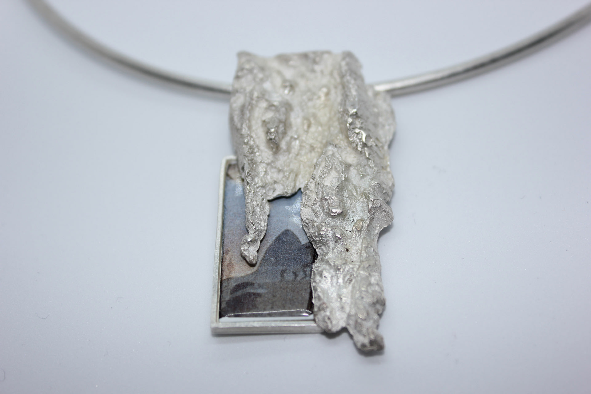 Secret Memory, Sterling silver, photograph and enamel pigments.