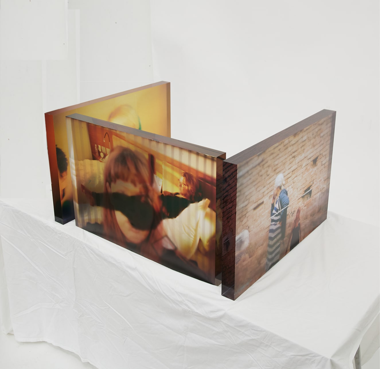 another view of the work from the right. The images of the artist are printed on the outer surfaces and mother in the inside.