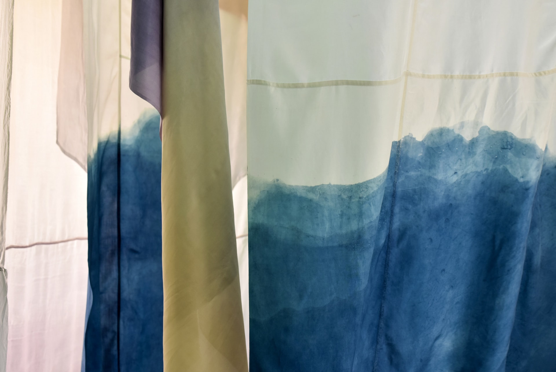 Naturally dyed silks layered next to each other