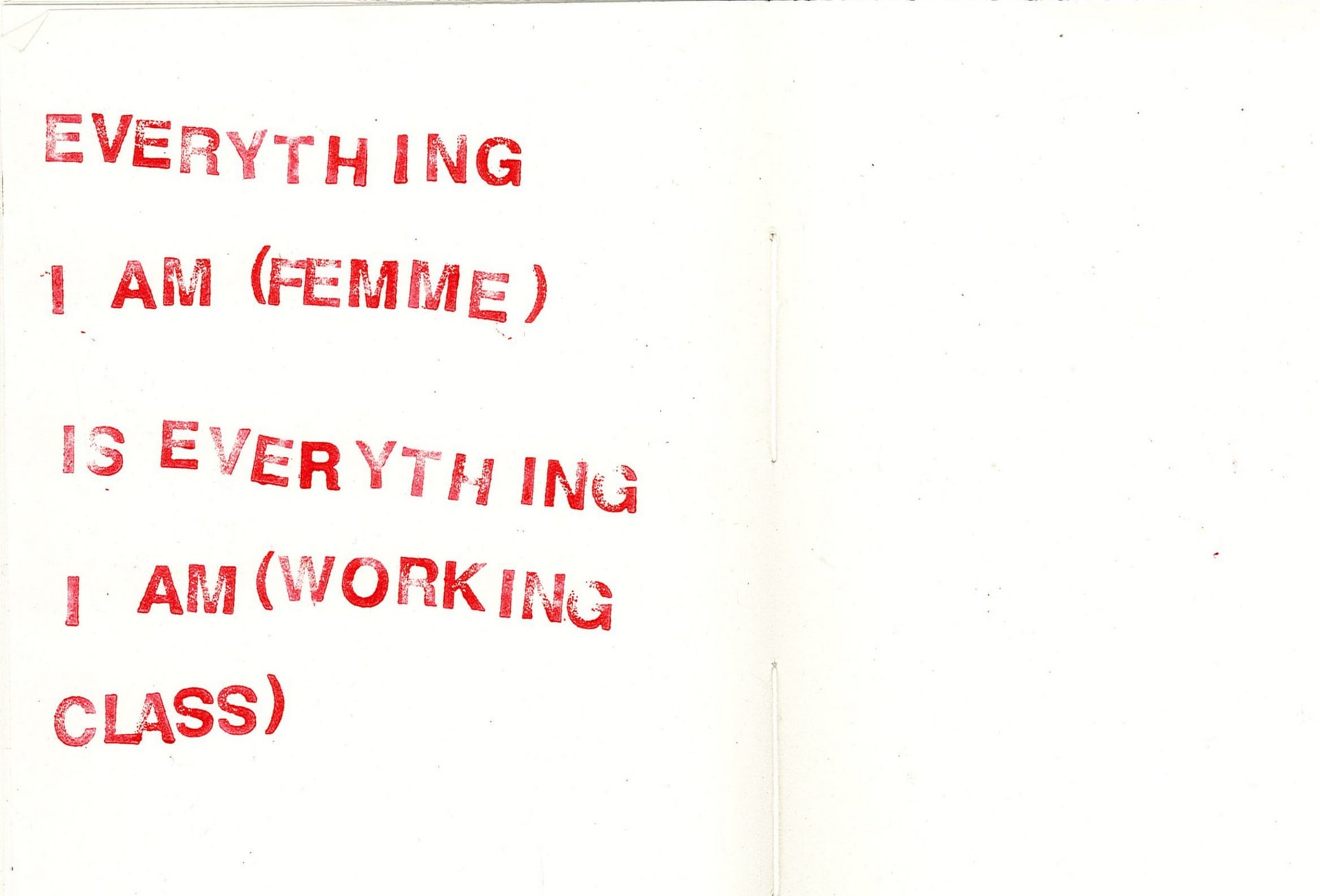 A scan from a notebook. Text in red stamped ink reads: EVERYTHING I AM (FEMME) IS EVERYTHING I AM (WORKING CLASS)