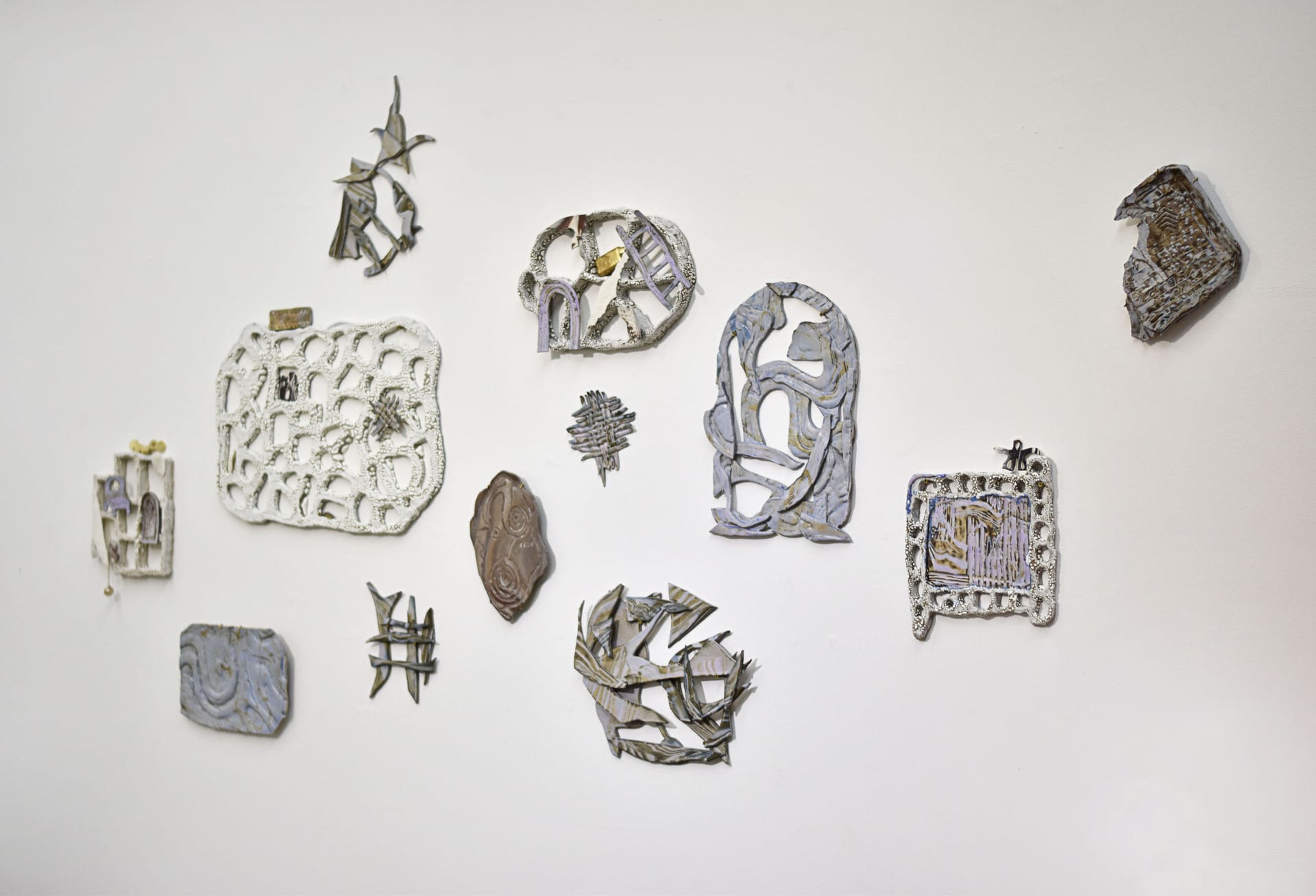 12 wall based ceramic assemblages, with Marbled clay, excavated with tools in soft hues of pinks, blues, purples and browns