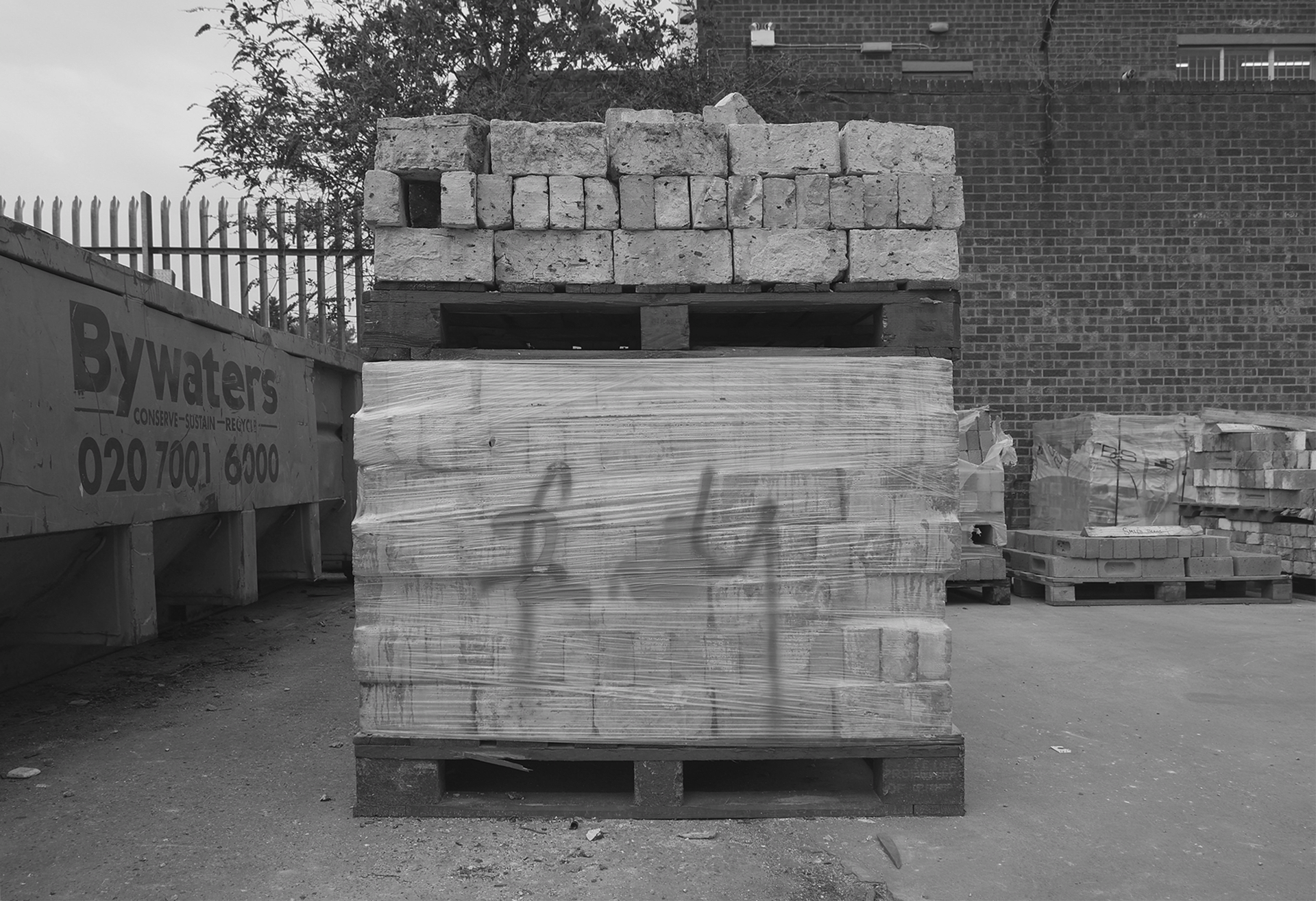 pile of bricks covered by plastic film with steam on it