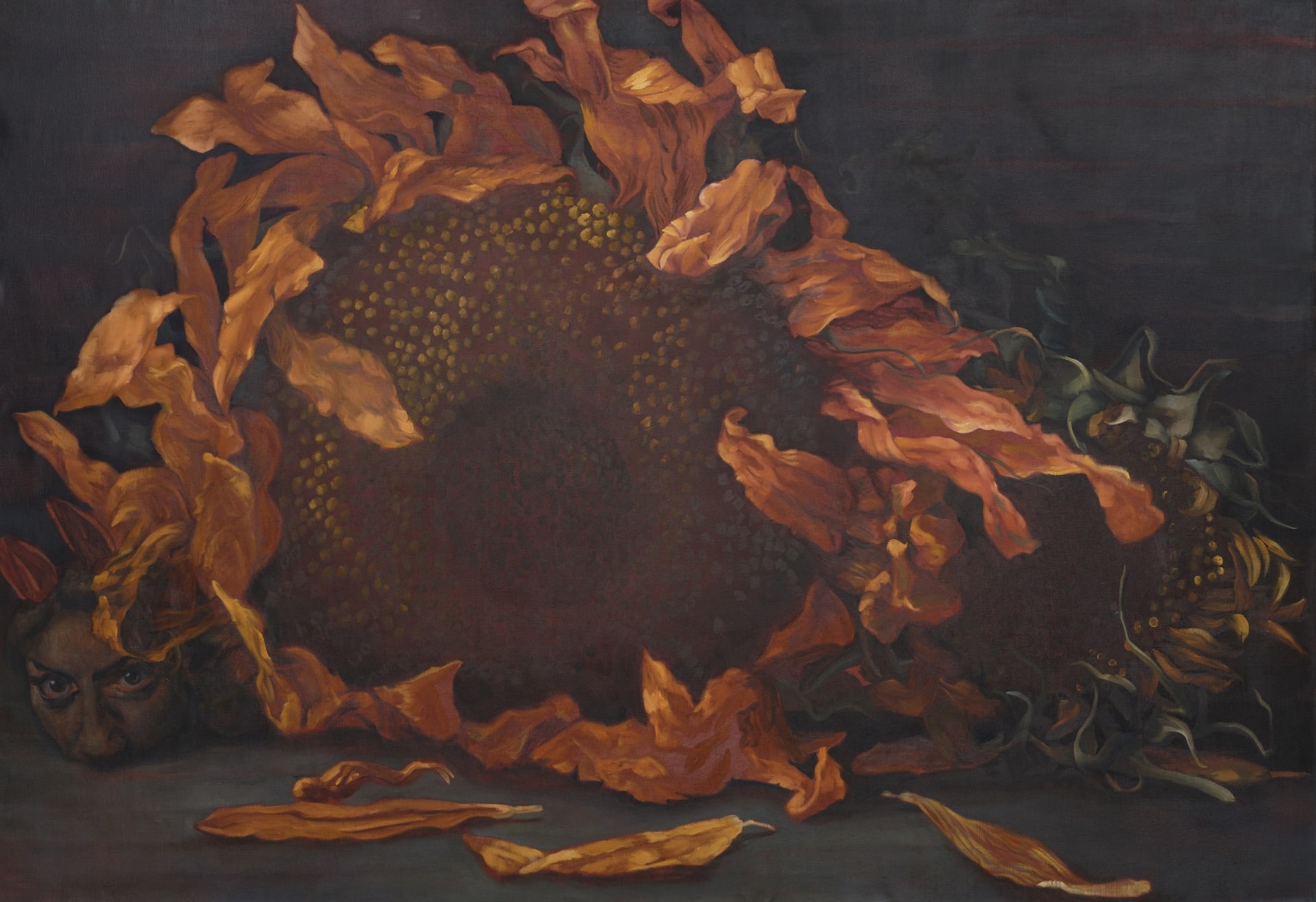 still life with two sunflowers and a human head