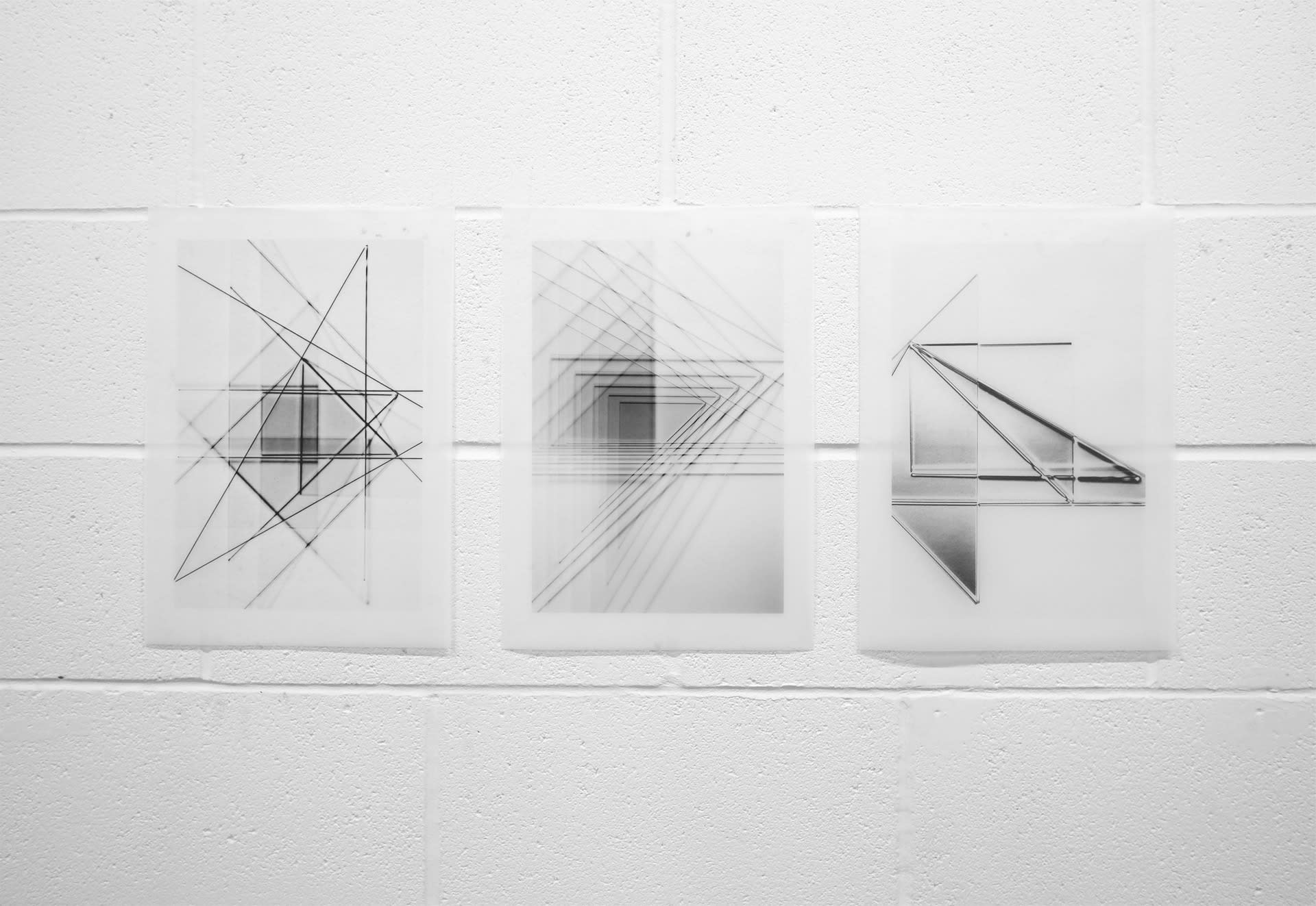 Three different images of black lines made with acrylic triangles on a white background