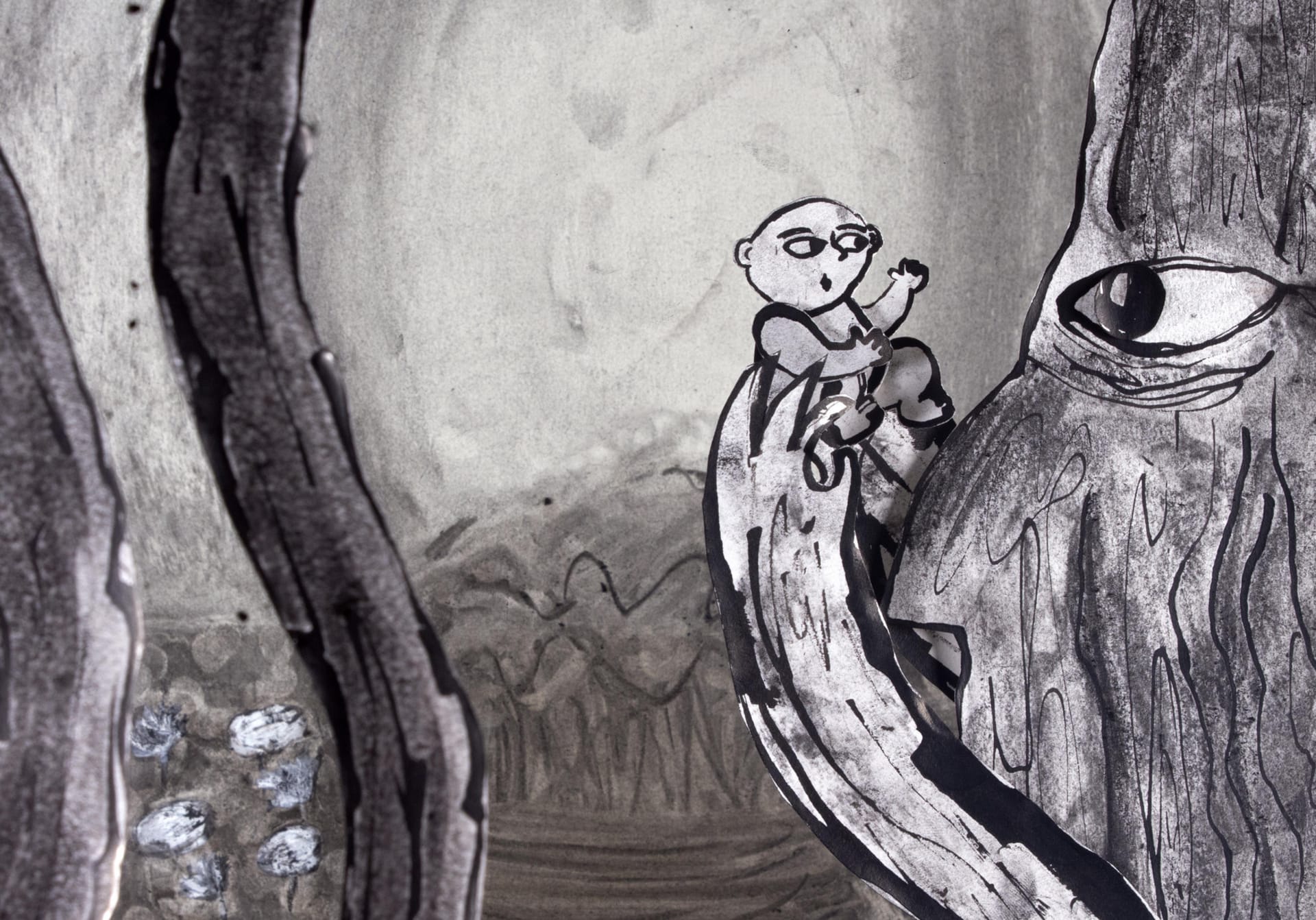 Still image from film. A large tree holds a baby up near its face with its root hands and they stare into each others eyes. 