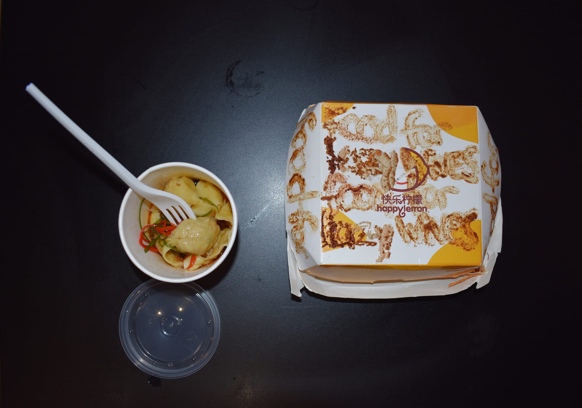 Message of 'Food for Lazy Wives' written all over the takeaway box using bean curd sauce, with the word 'Lazy' hand embroidered.