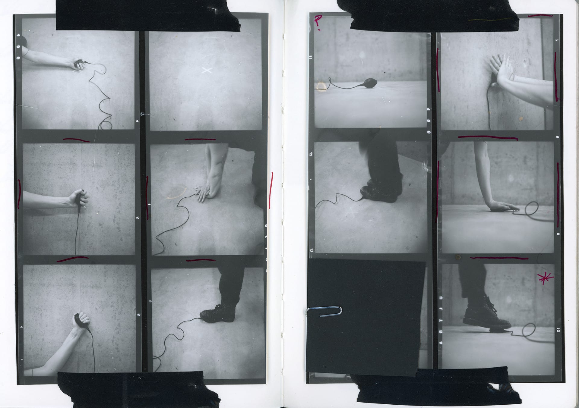 Sketchbook picture showing a contact sheet with red annotation, images of a cable release being pressed with hands and feet