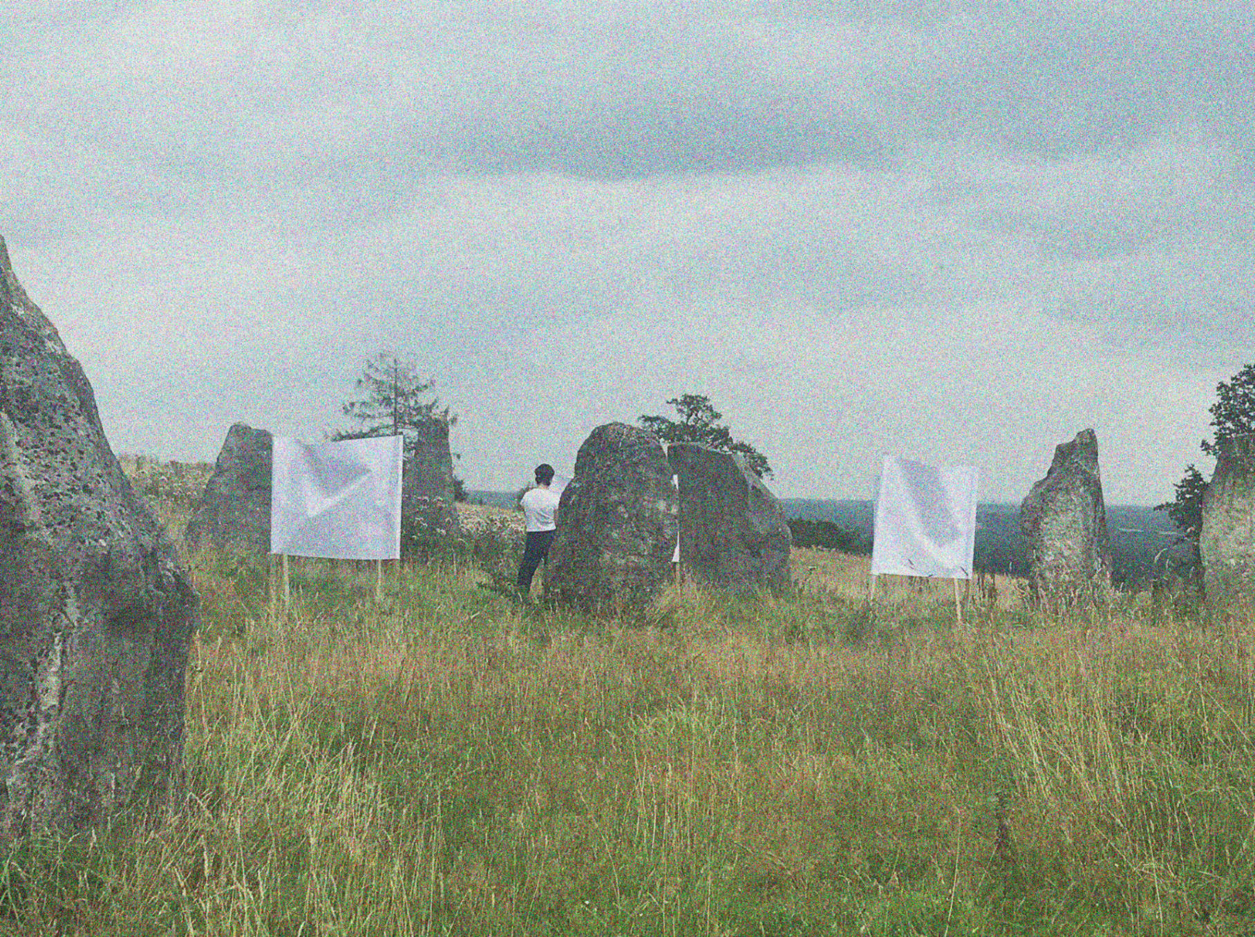 Assembling the circular scroll in and around the stone circle.