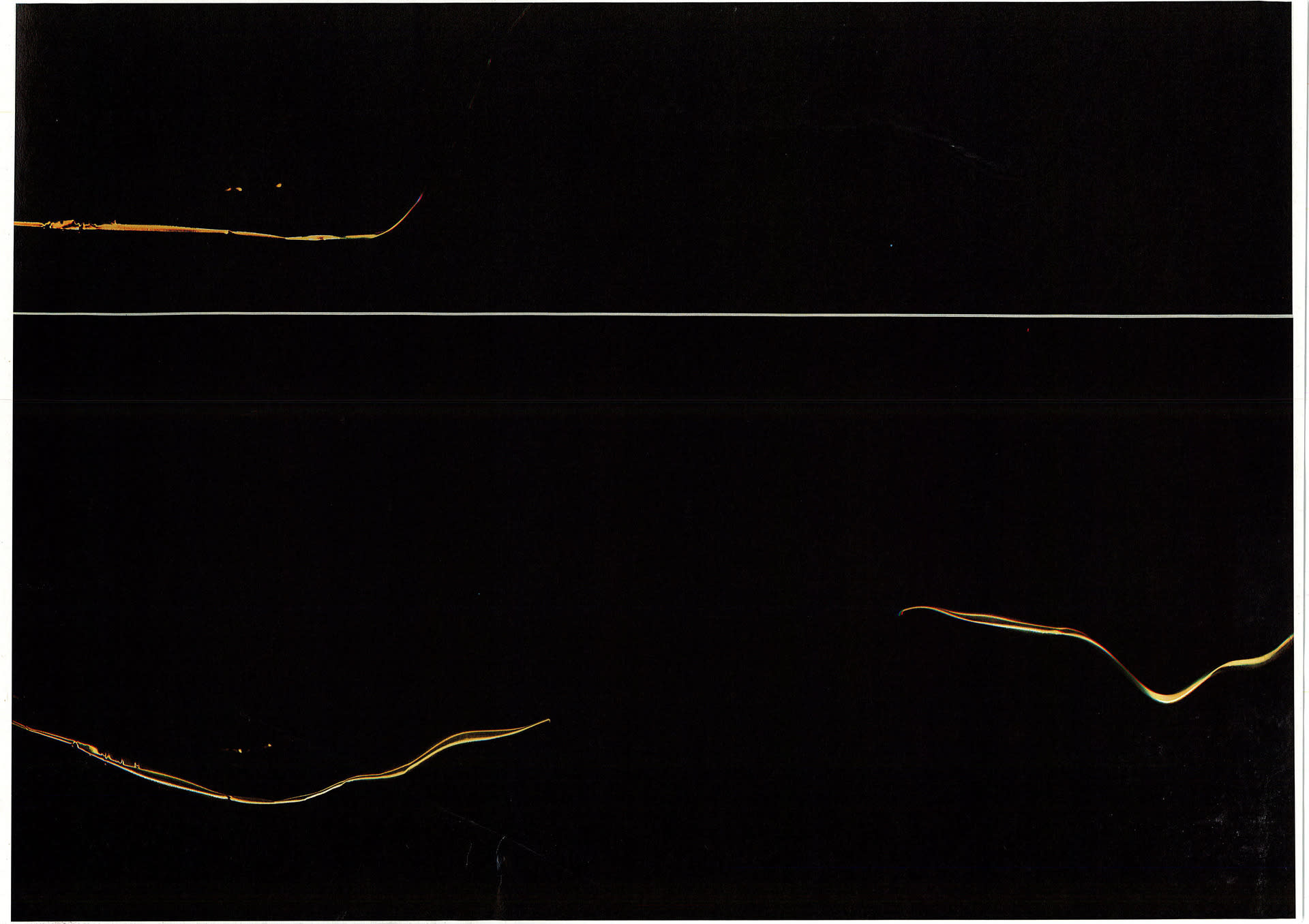 Three slithers of gold lines in black space with white horizontal dissecting line