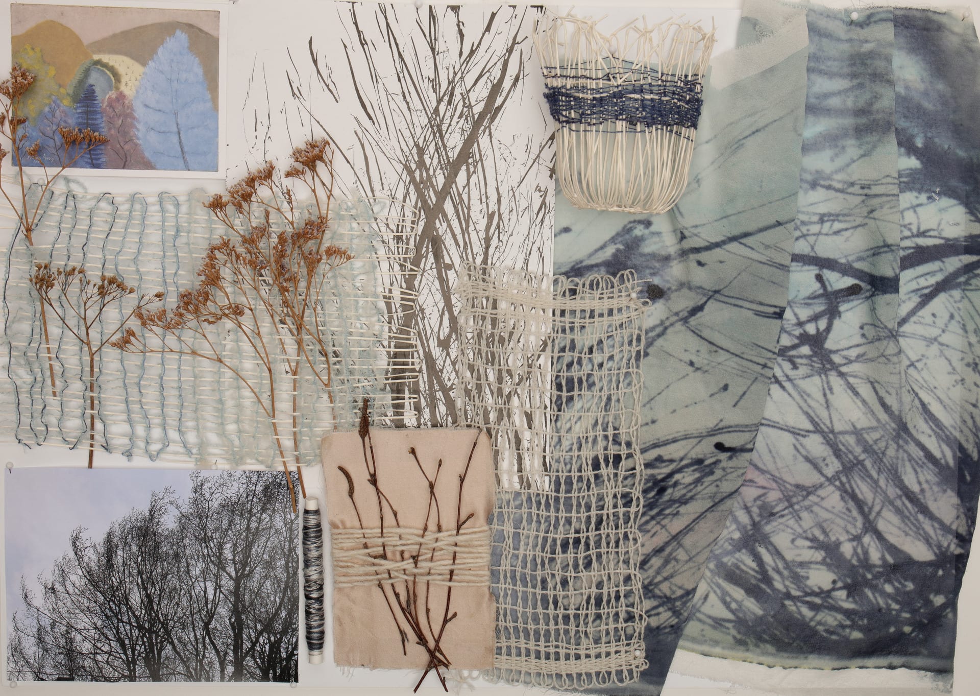 A moodboard shows paintings, photographs and woven samples including an image of winter trees. The colours are shades of blue