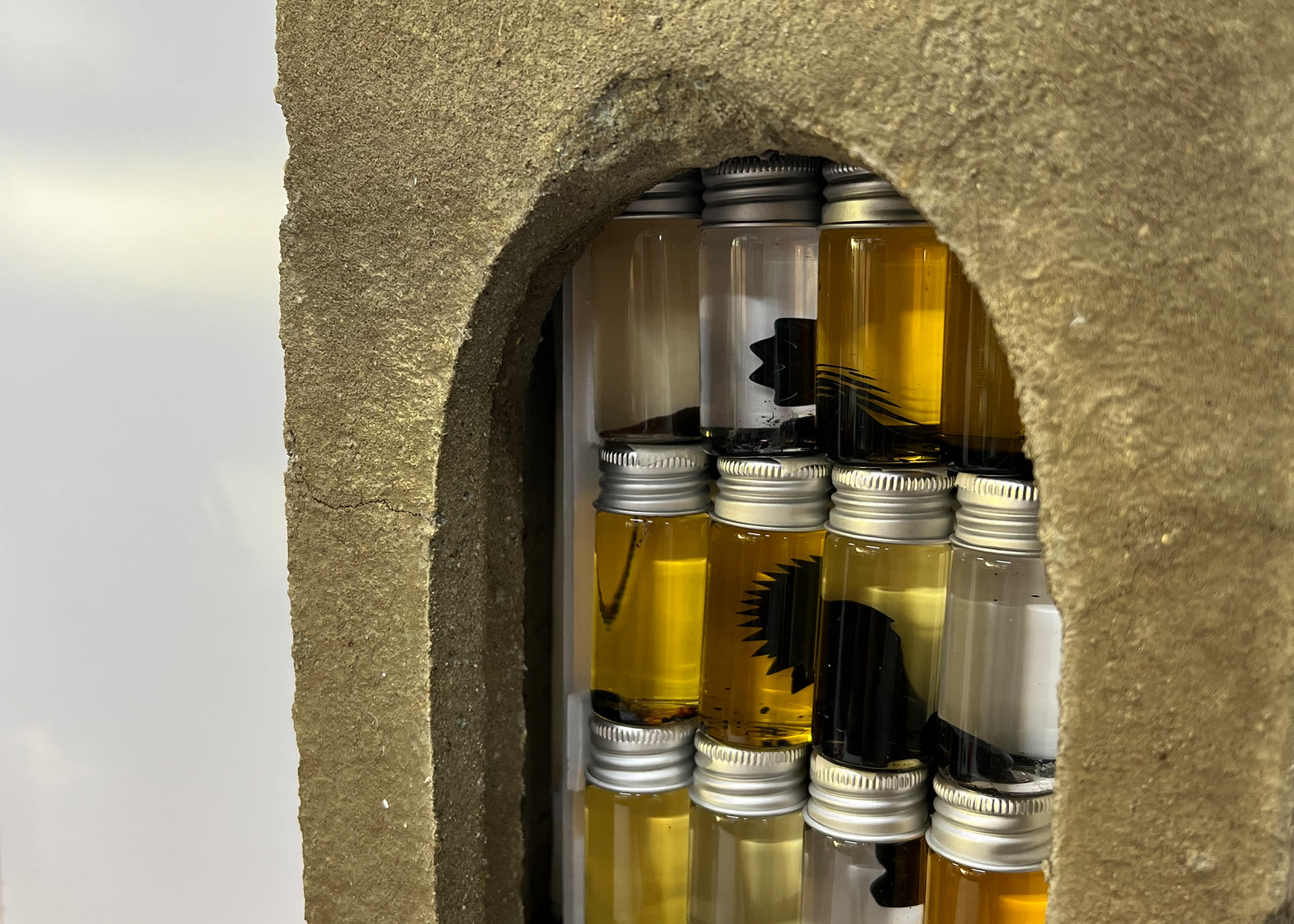 Subject <--> Matter Sculpture, Concrete box with window with vials of ferrofluid.