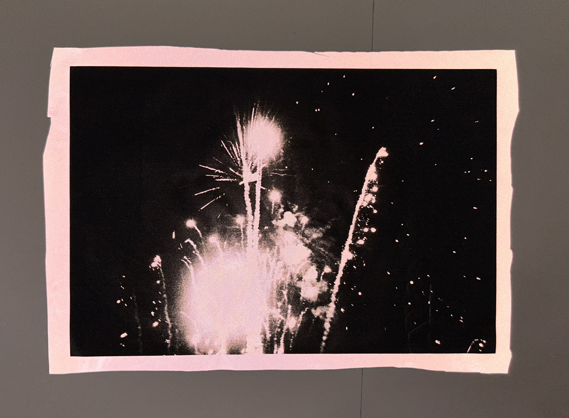 image of firework on reflective material with flash