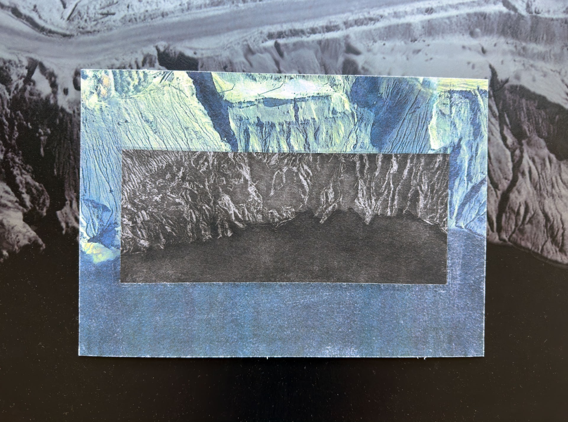 Hand drawn etching in the centre of a digital print and UV print on steel depicting the landscape and water.