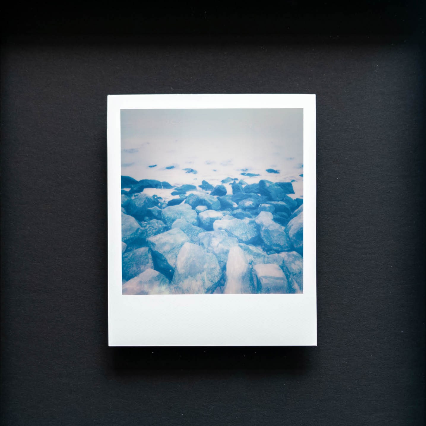 Where I Learn to Breathe: artifact 51.364542, 3.367316. Framed Polaroid. Available on shopify.