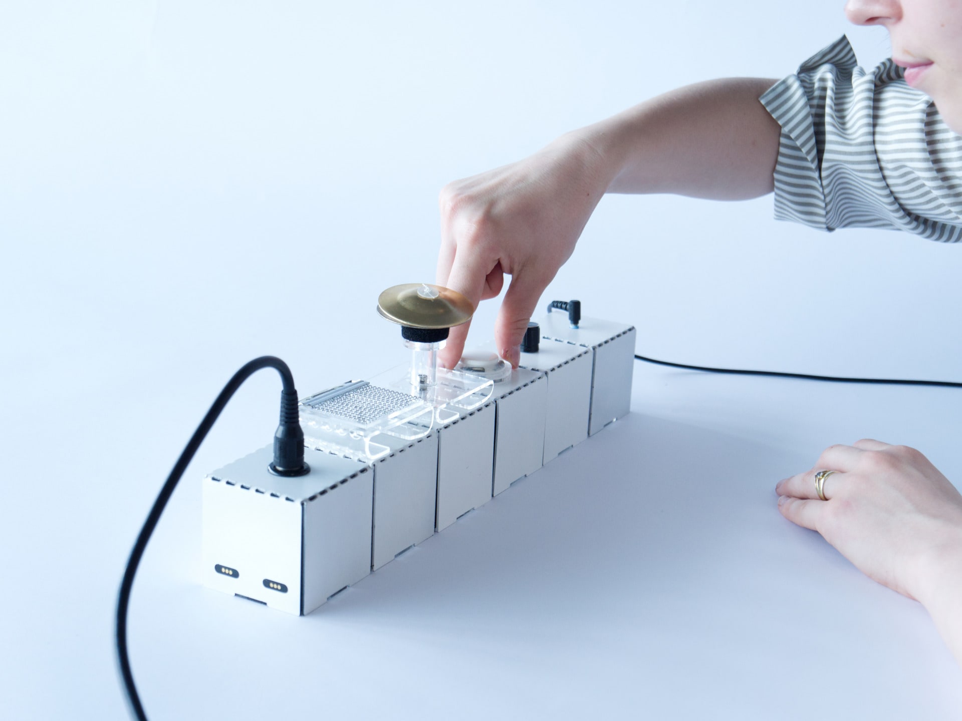 A person using Sound Brick to experiment sounds.