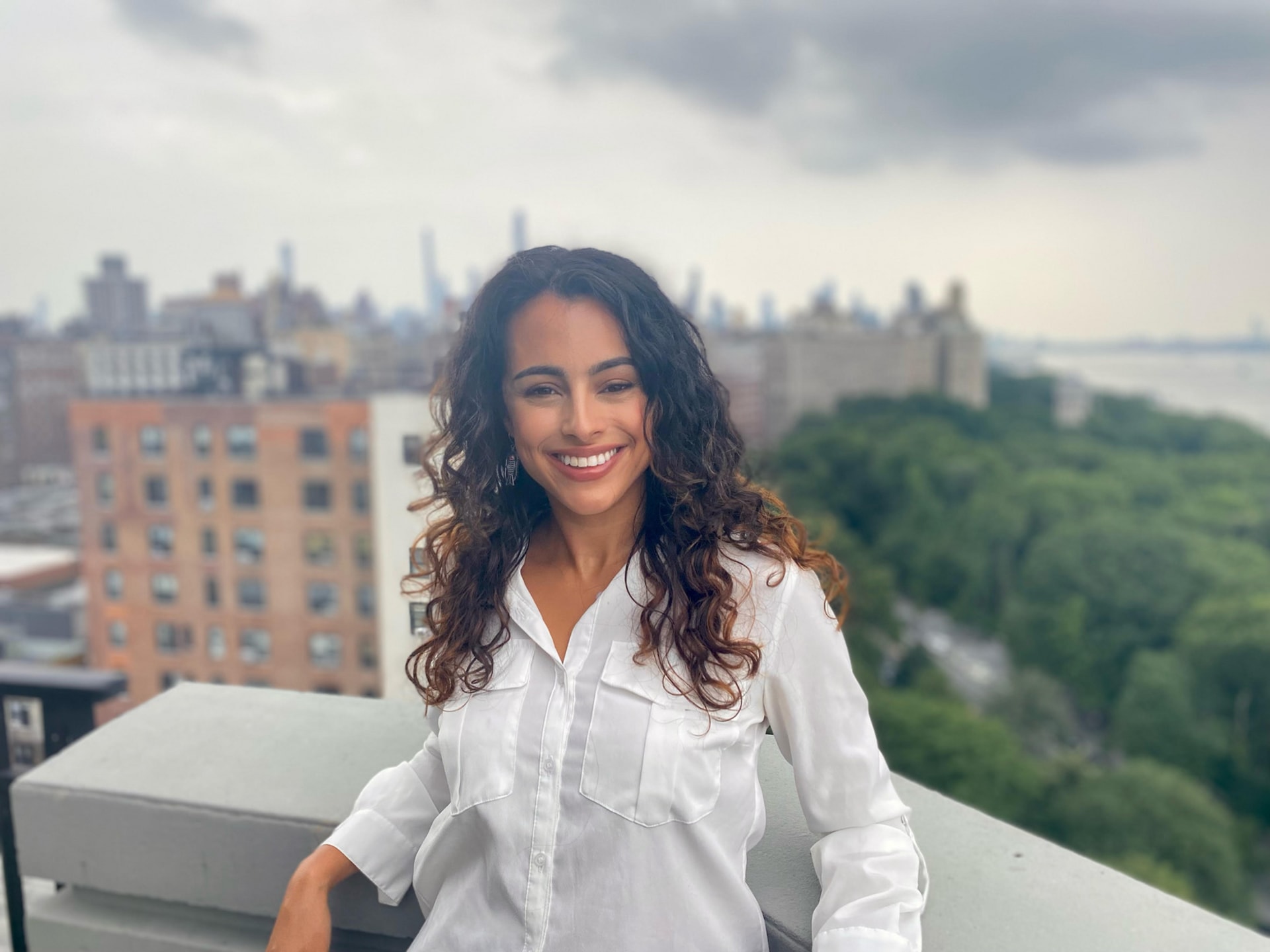photo of me smiling with nyc in the background