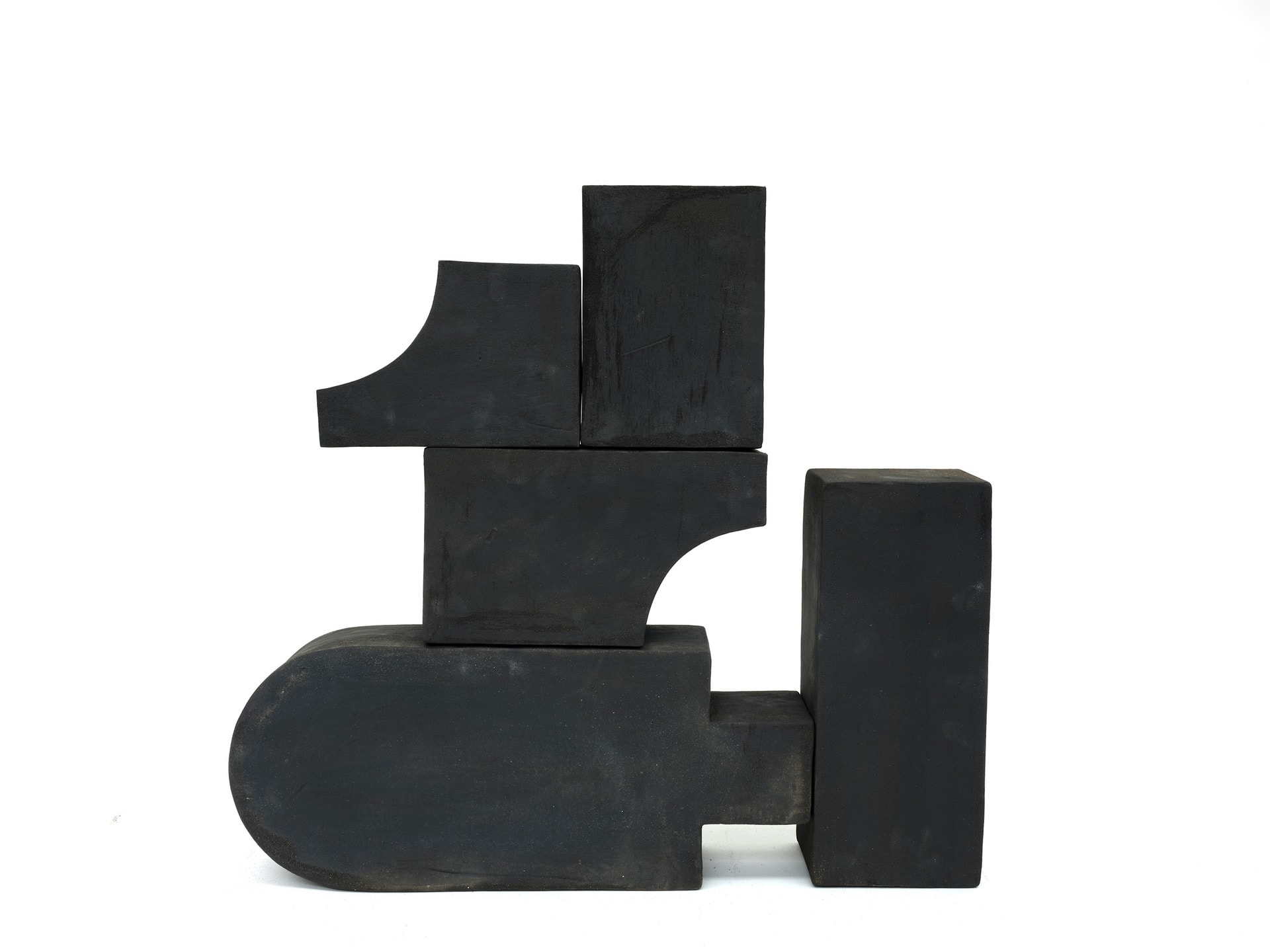 Five different black clay forms 