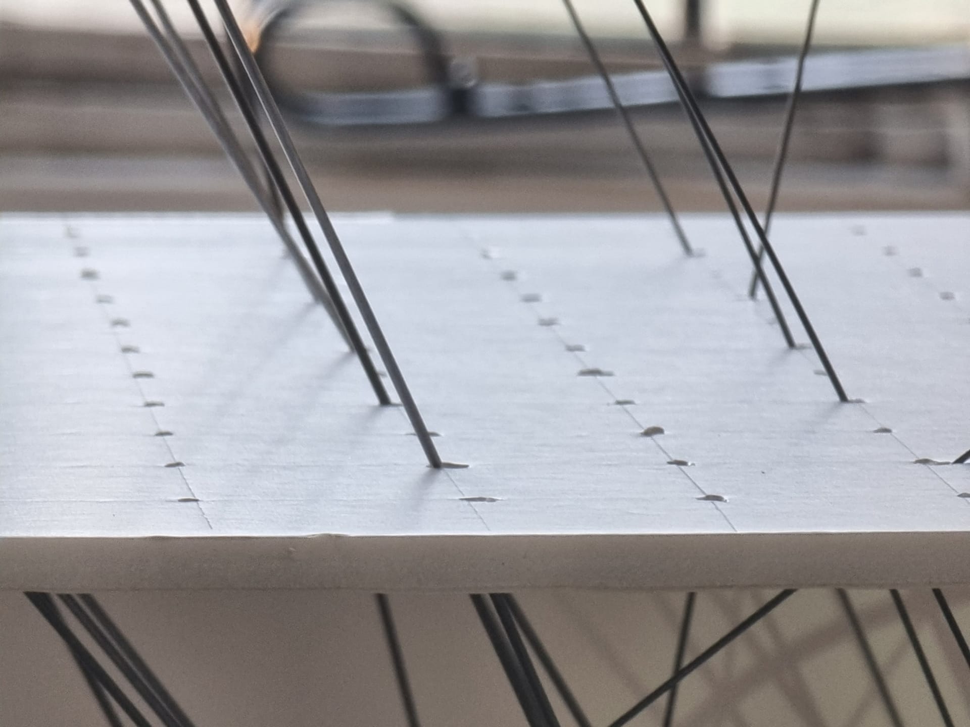 close up of piano wire instrument from sound installation 