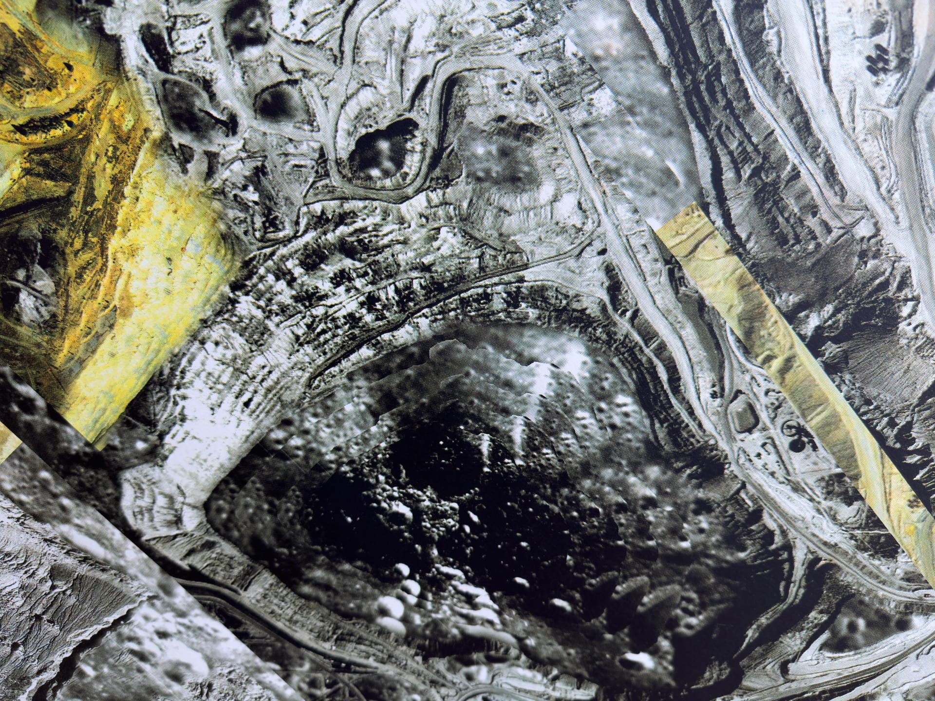 Detail of screen print on paper depicting an open pit mine.