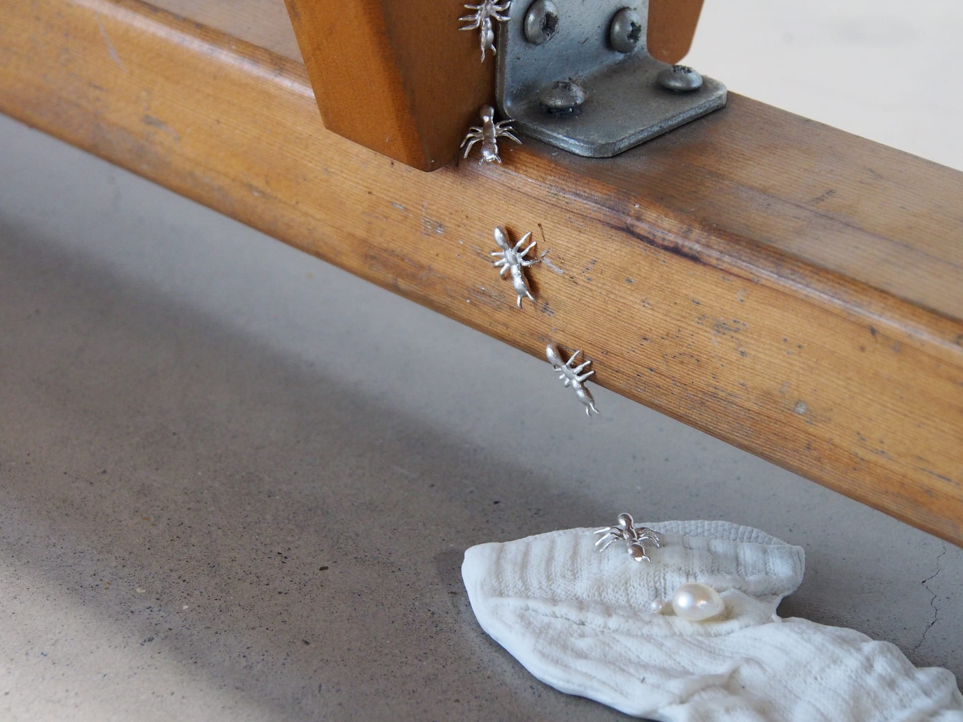 silver ant trail leading down to a ceramic sock