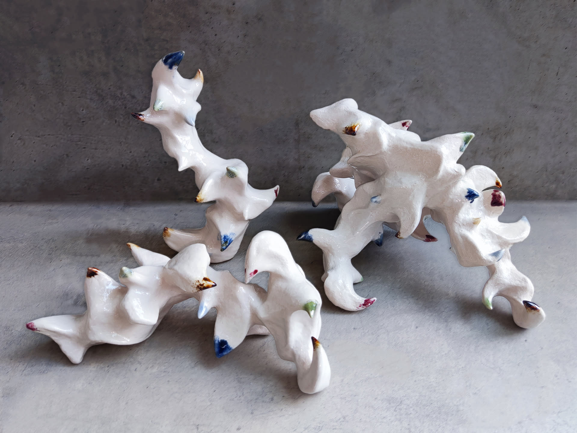 A group of zoomorphic sculptures with color on their spines