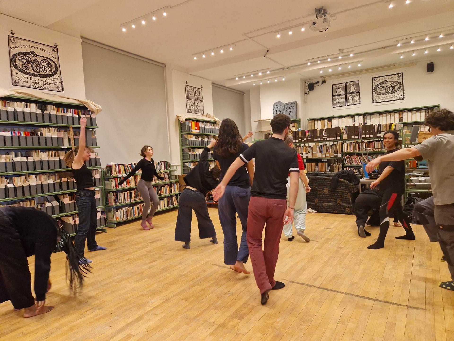 Photo of participants at the 'Improv Dance Workshop' at The Feminist Library.