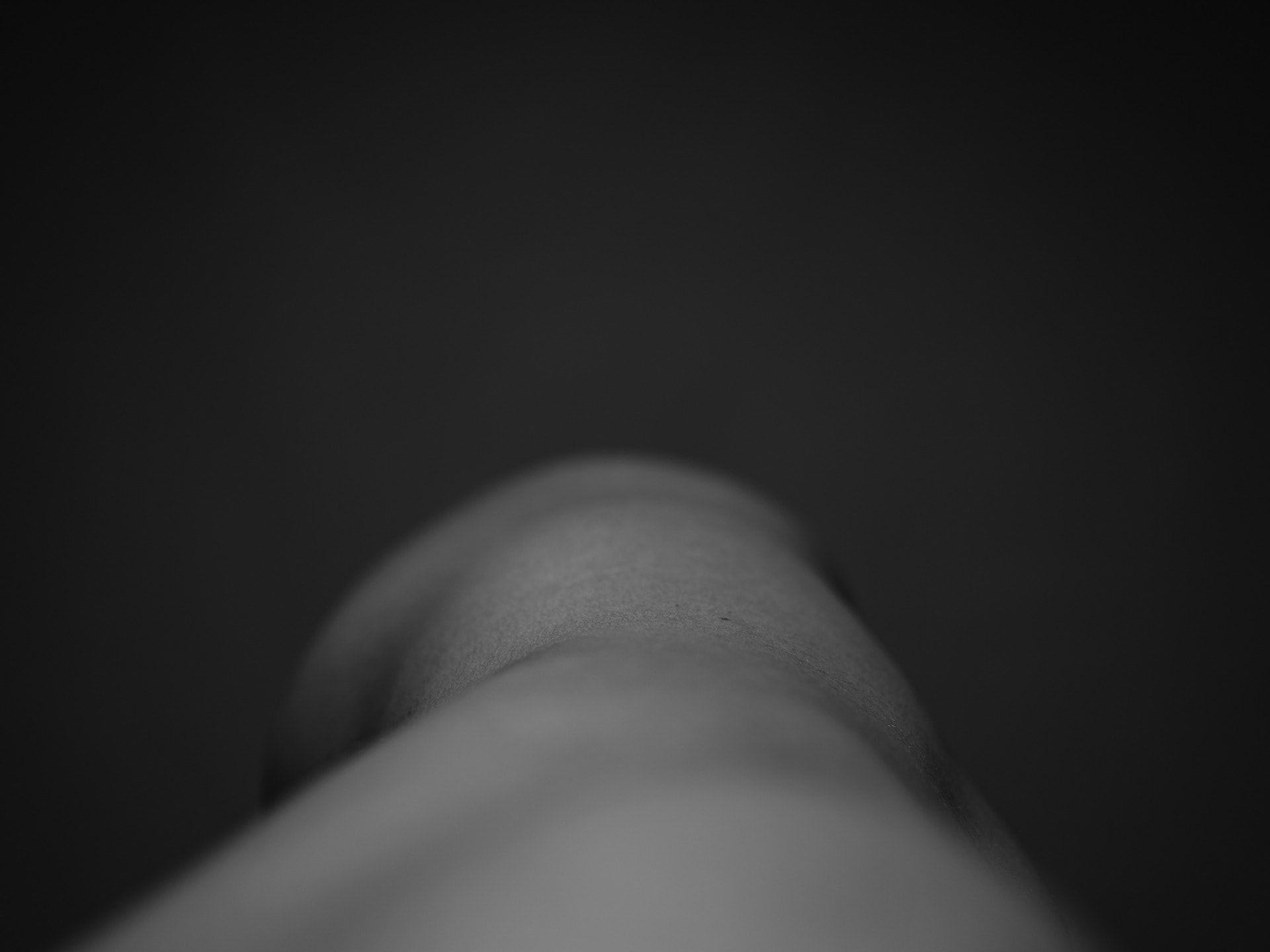 Black and white side of womans body taken from eye level