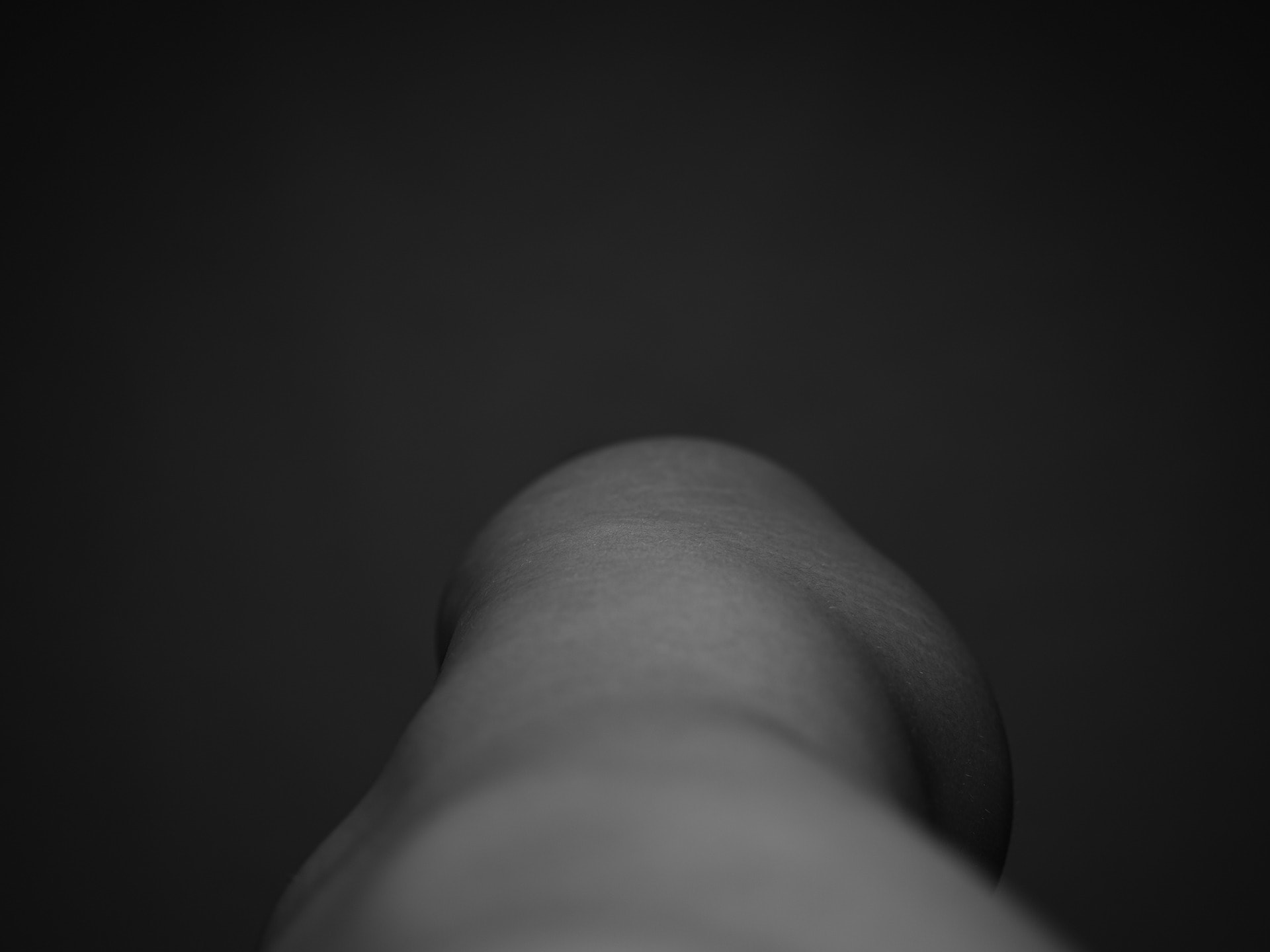 Black and white right side of womans body taken from eye level