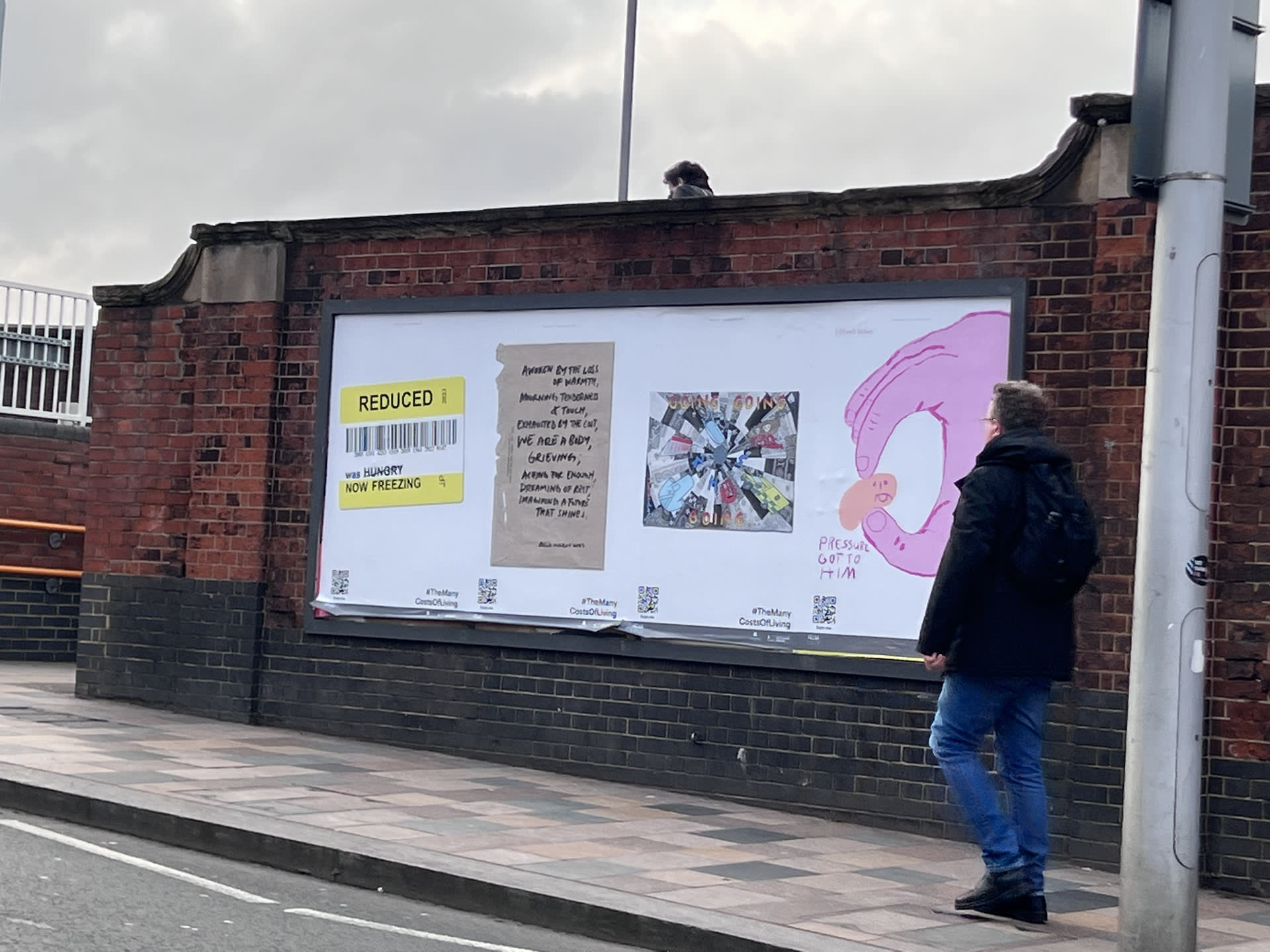 A photo of four protest banners on the street near Clapham Junction about the cost-of-living crisis in the UK 