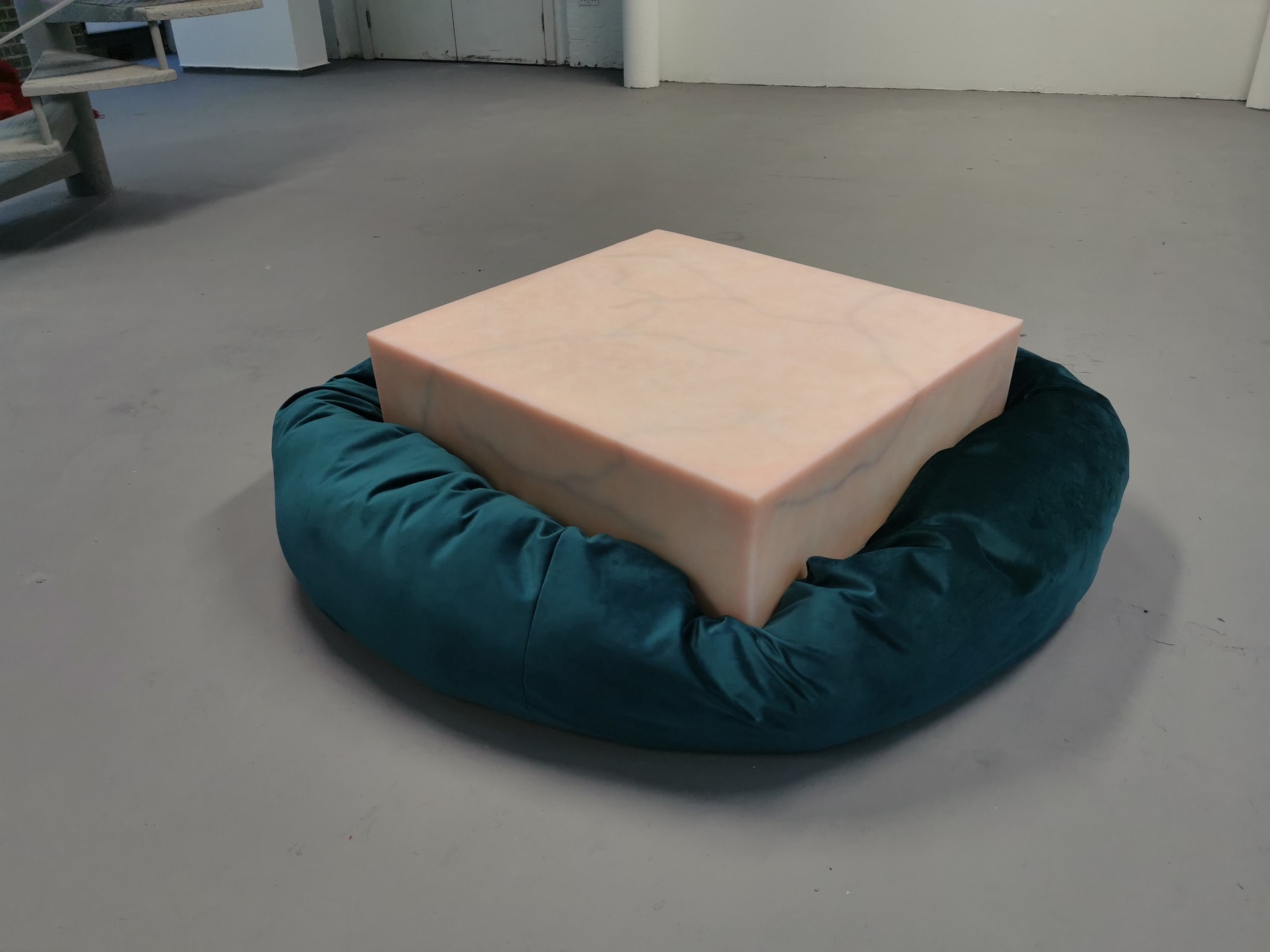 Block of Flesh sat on a deep blue beanbag.