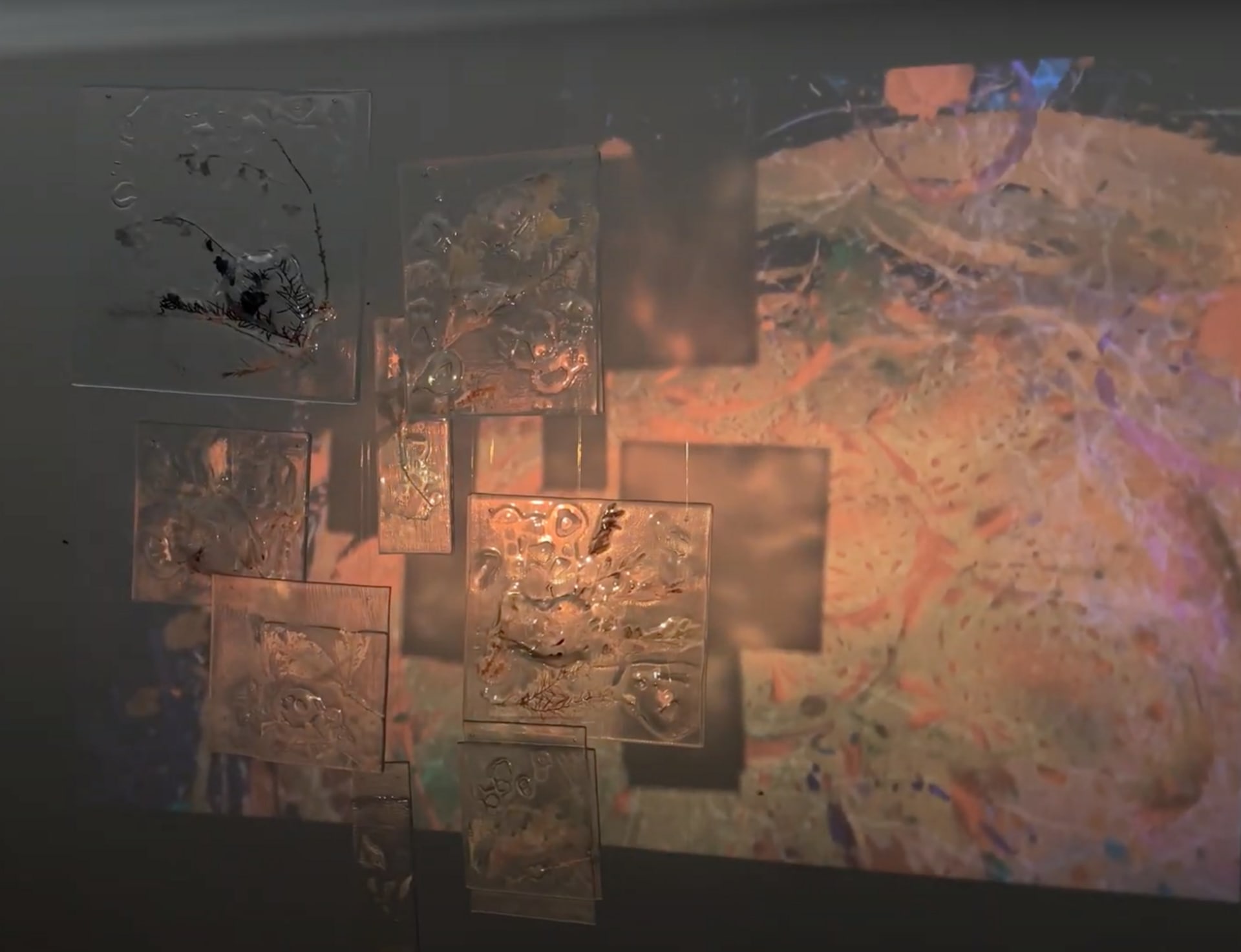 Different angles of the glass sheets that are being projected with other moving images