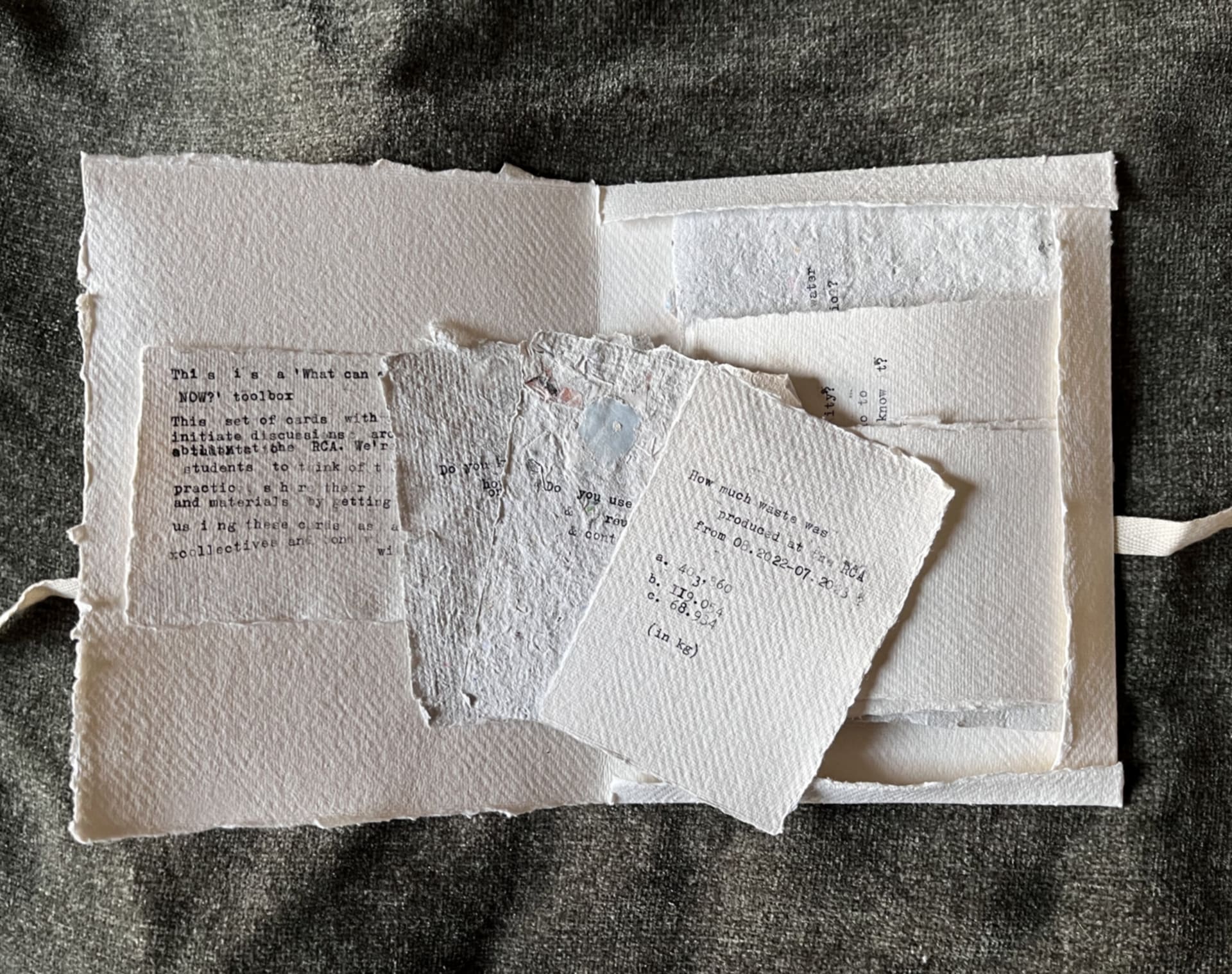 Envelope made from hand-made recycled paper with title on it ´What can each of us do NOW?´