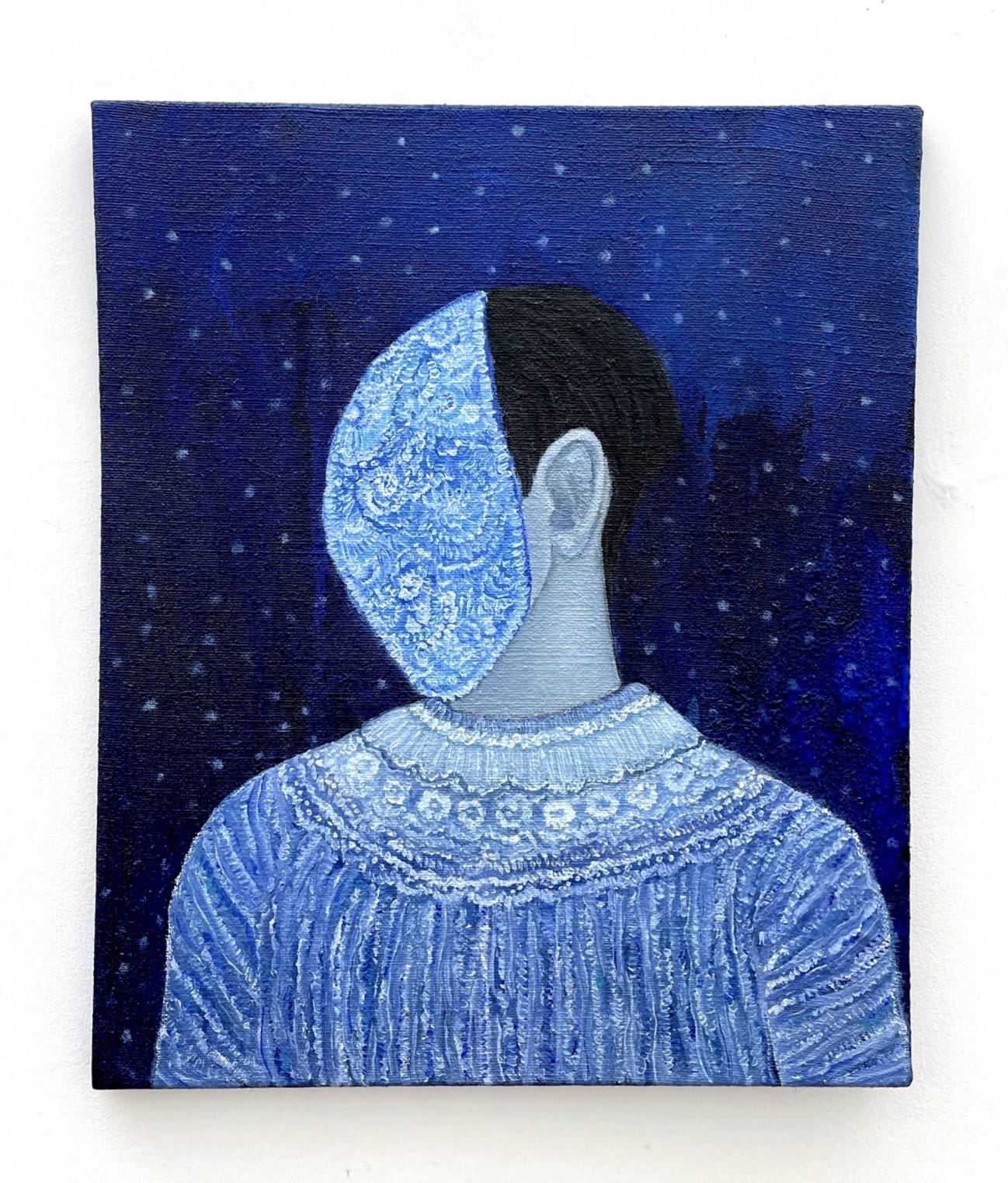 figure with covered face with a patterned mask