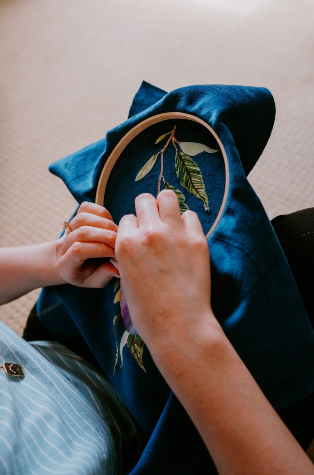 Embroidery of a pomegranate plant