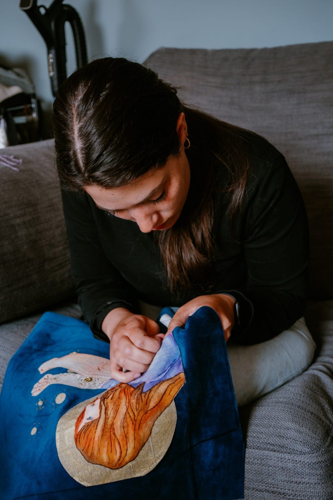 Woman working on an embroidery piece